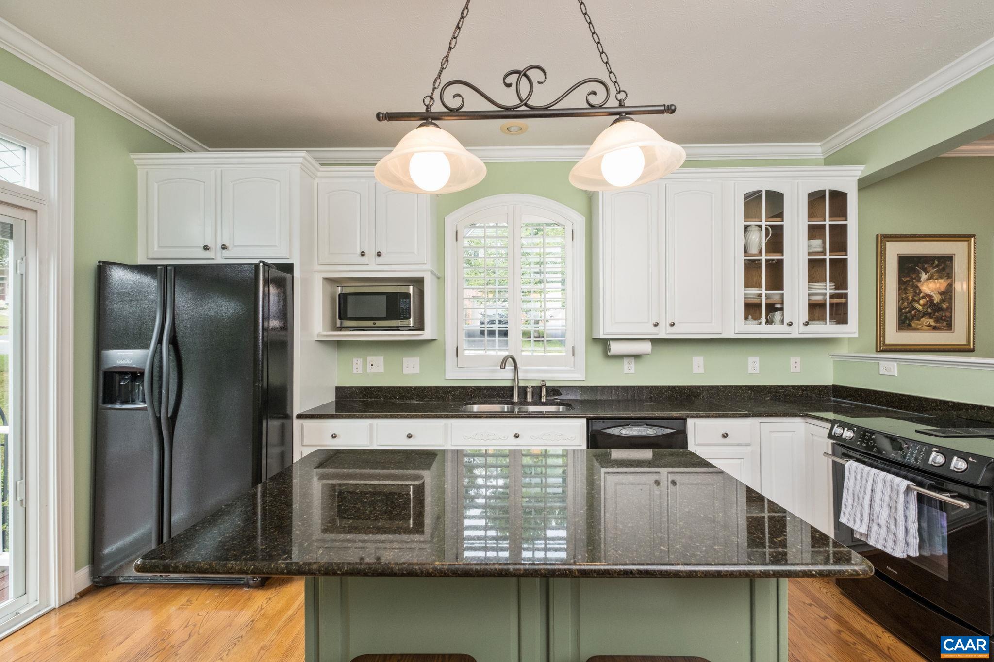 Enjoy plenty of countertop space with the large island, plus plenty of cabinetry and a pantry. Enjoy plenty of countertop space with the large island, plus plenty of cabinetry and a pantry.