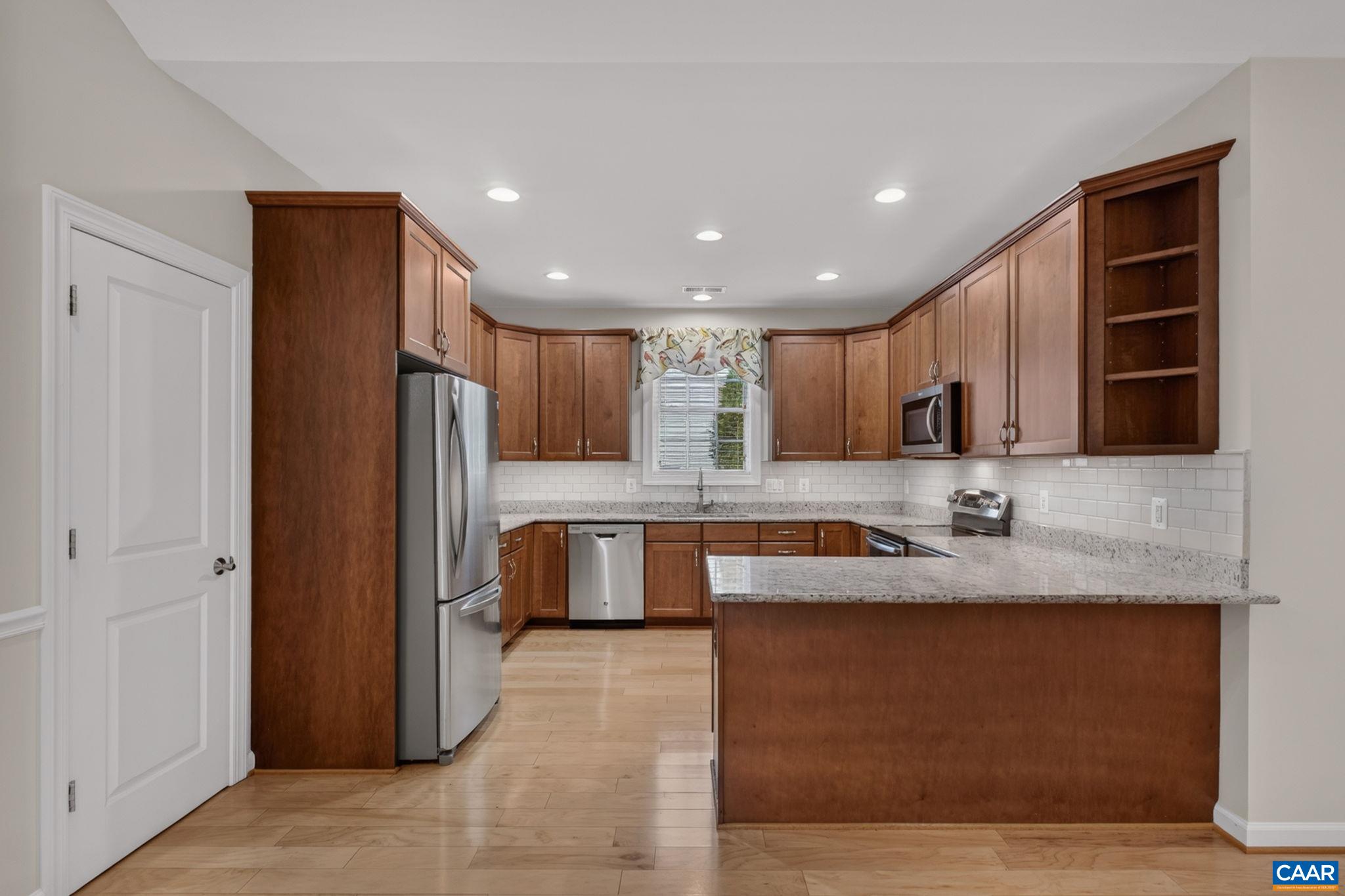 42 Inch cabinets and pantry closet offer optimal storage 42 Inch cabinets and pantry closet offer optimal storage