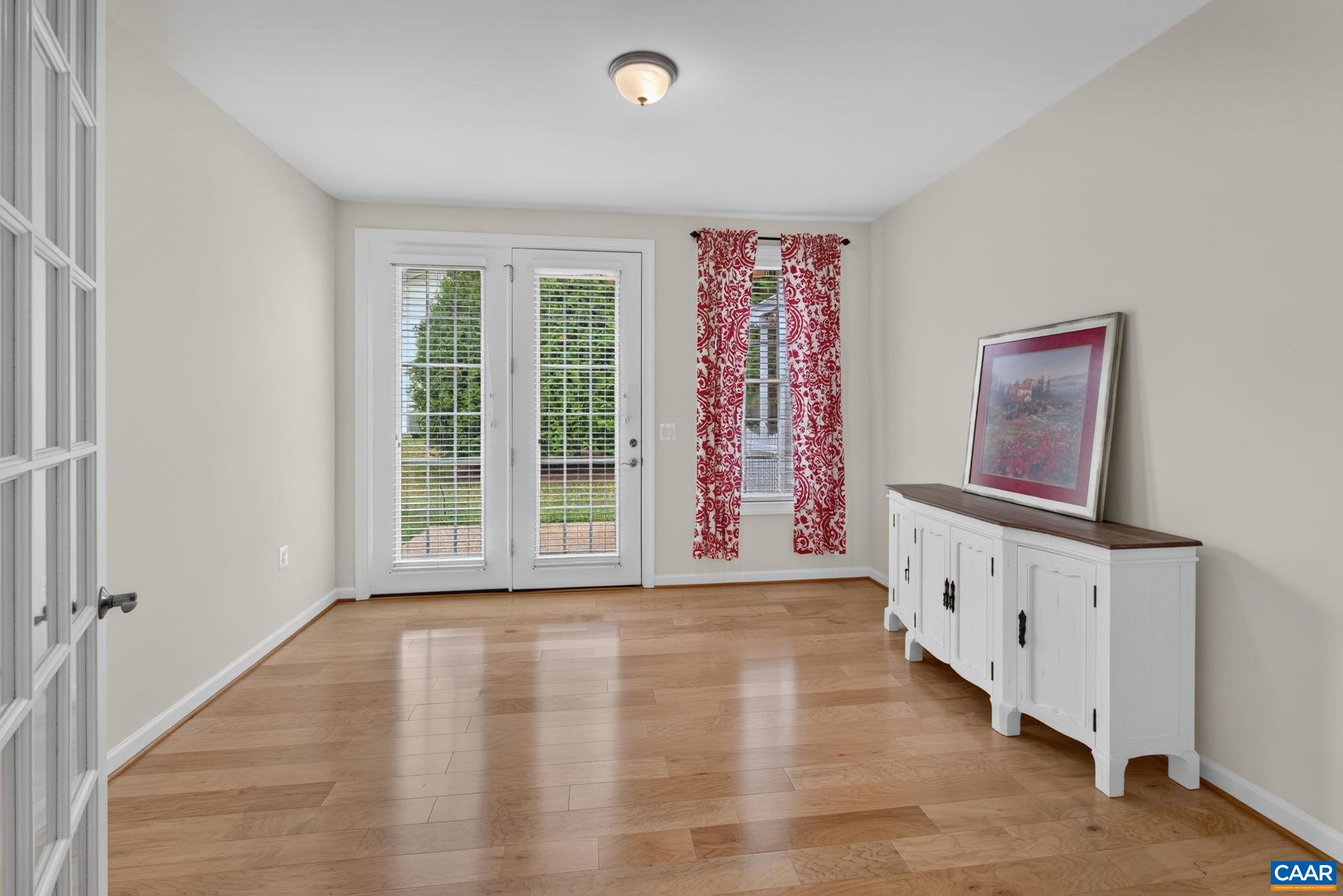 The cozy sunroom overlooks the back patio The cozy sunroom overlooks the back patio
