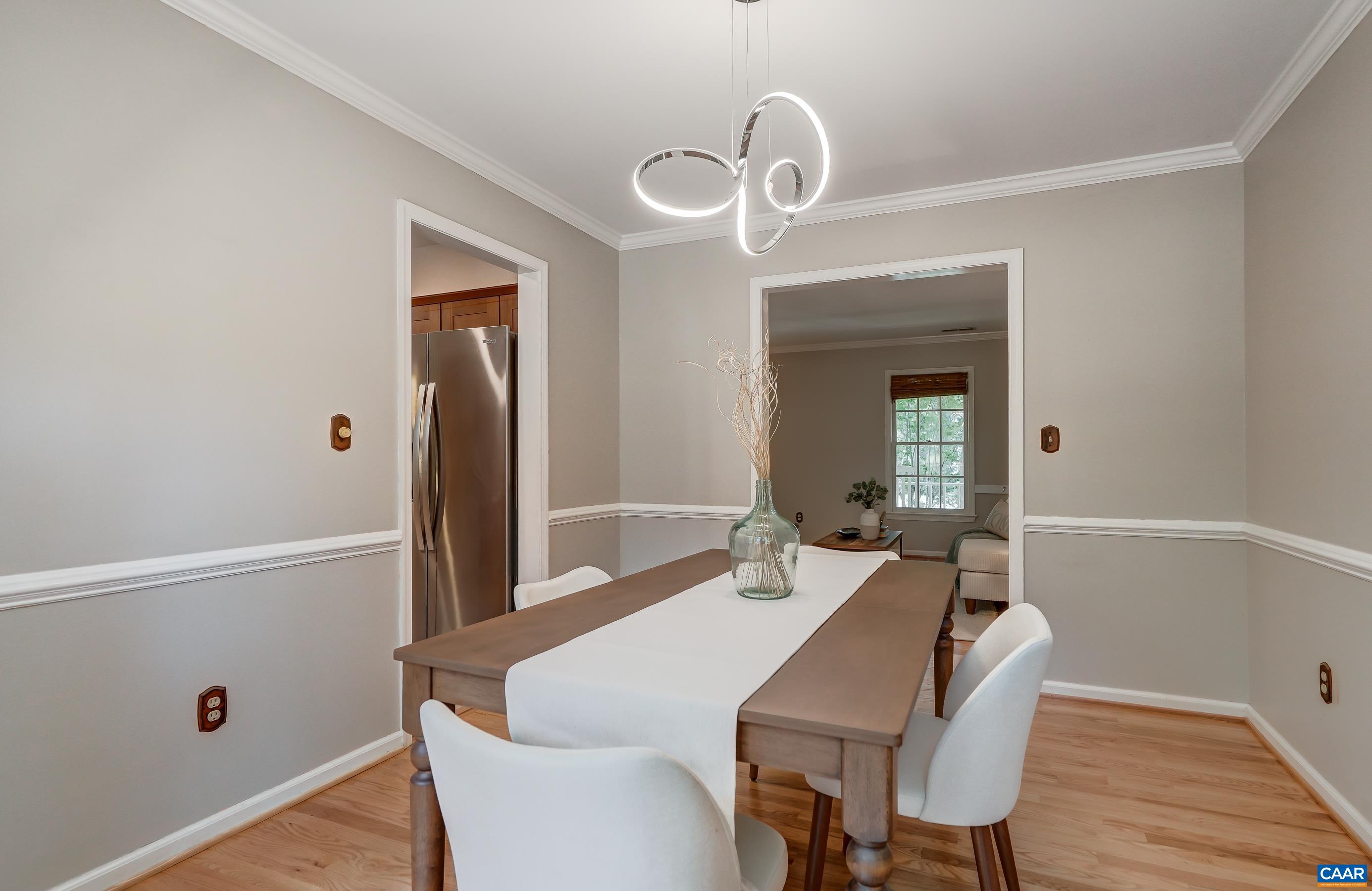 Formal dining room with modern LED light fixture. Formal dining room with modern LED light fixture.