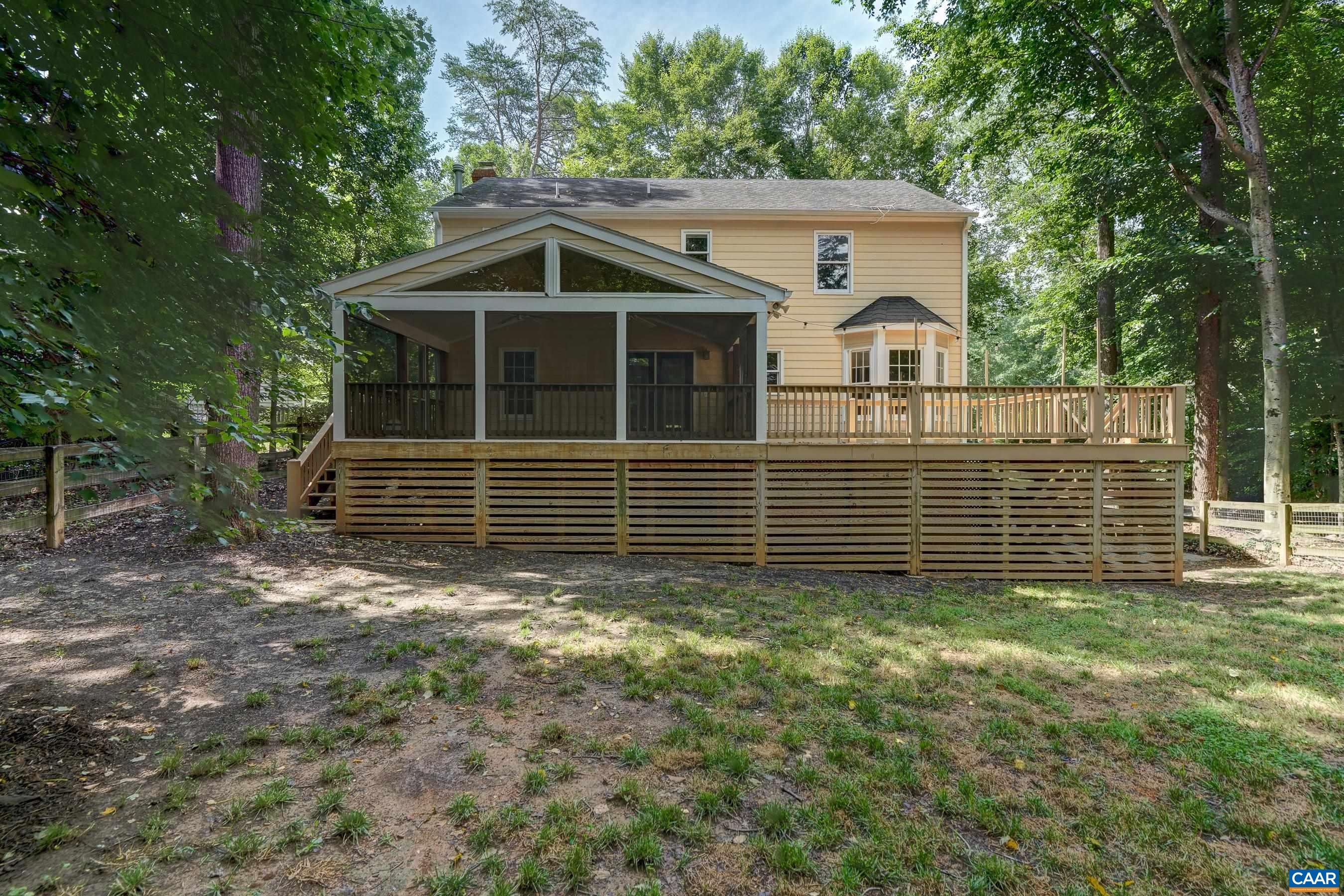 Flat fenced back yard with room to run and play surrounded by mature trees. Flat fenced back yard with room to run and play surrounded by mature trees.