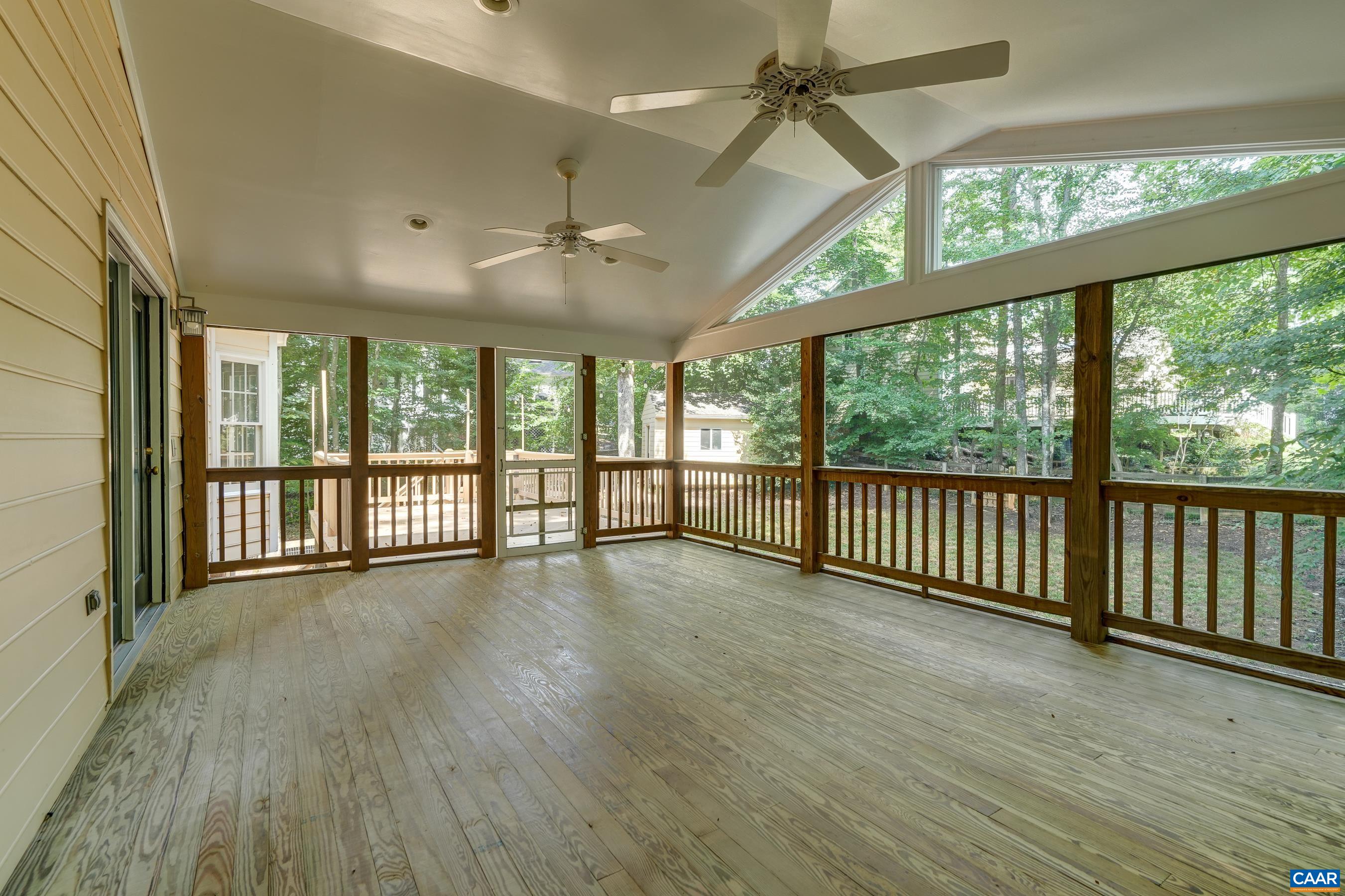 Expansive screened porch with vaulted ceiling and two fans! Expansive screened porch with vaulted ceiling and two fans!