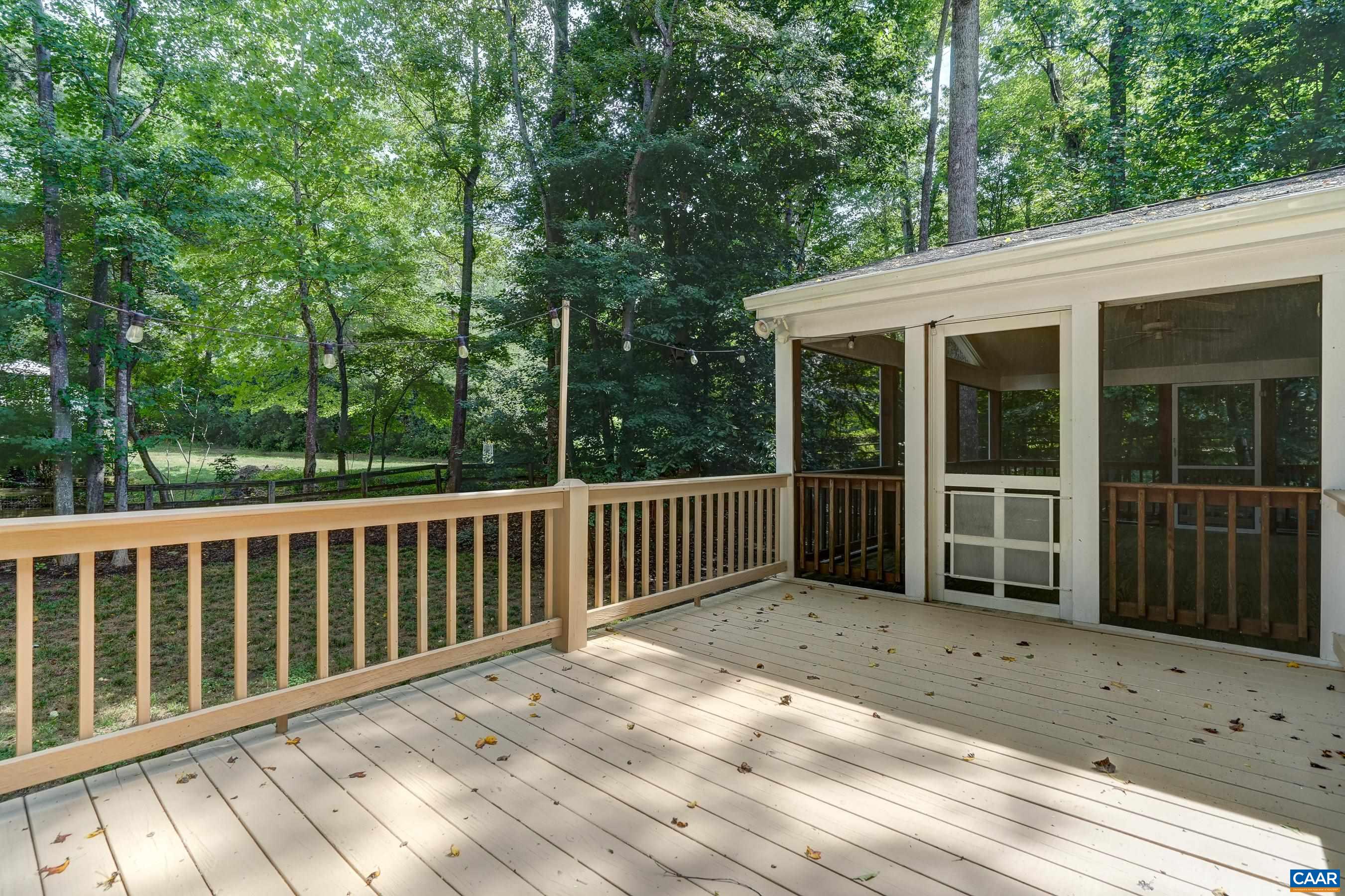 large open deck overlooks shady back yard. large open deck overlooks shady back yard.