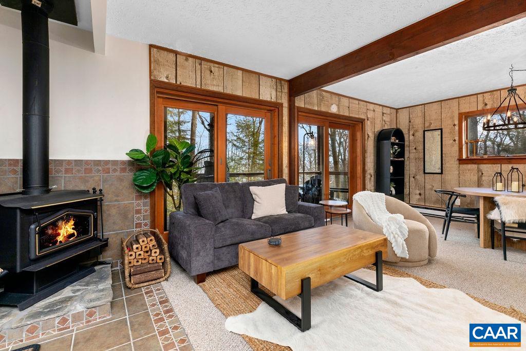 Lower level family room with a wood burning stove. Lower level family room with a wood burning stove.