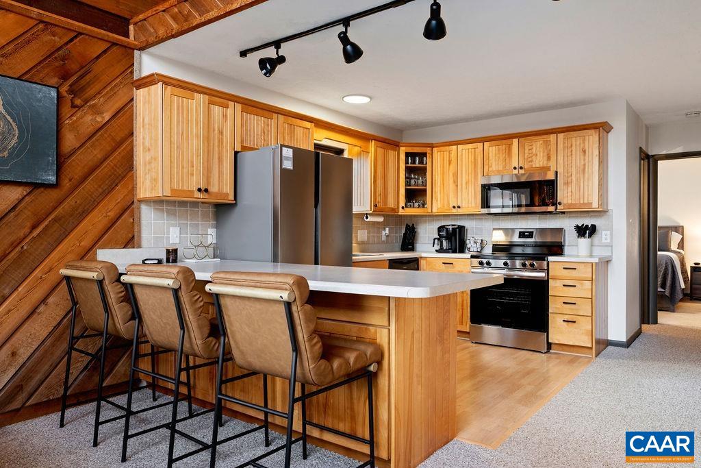 Home offers two kitchens, one on each level of the home. Home offers two kitchens, one on each level of the home.
