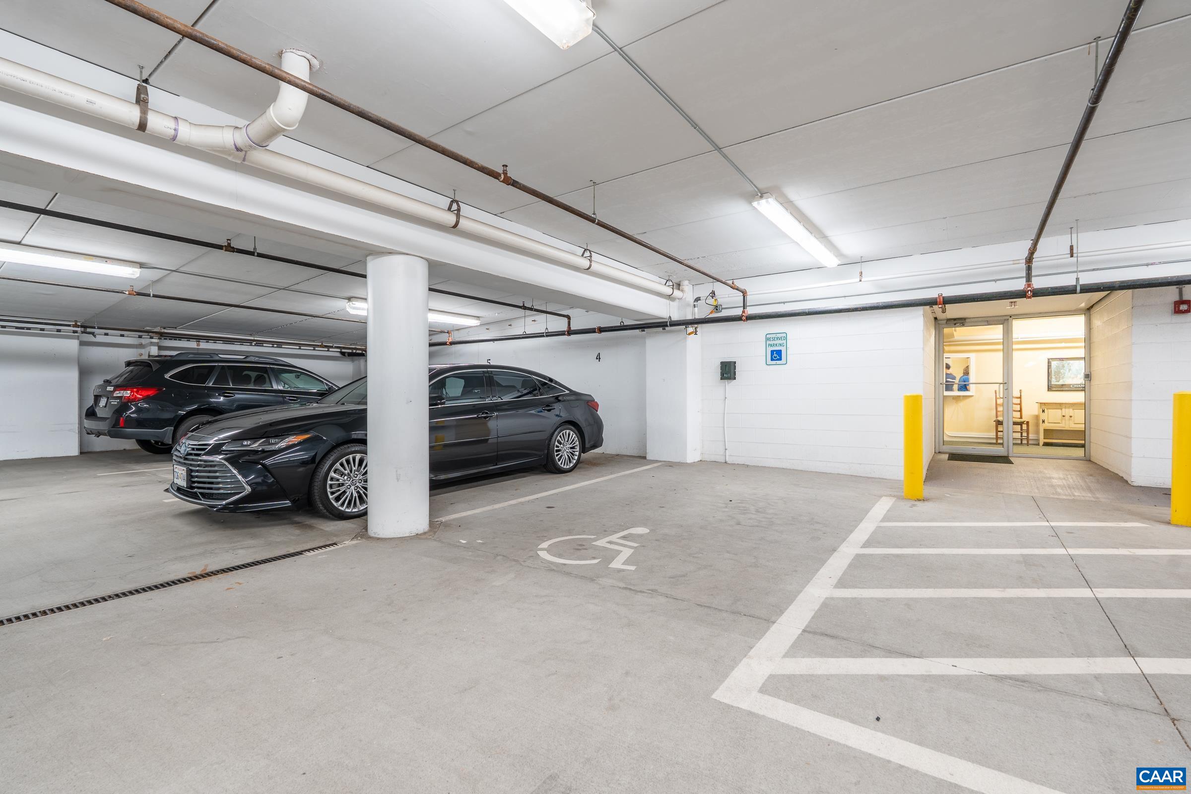 Two dedicated spots right next to the door/elevator!