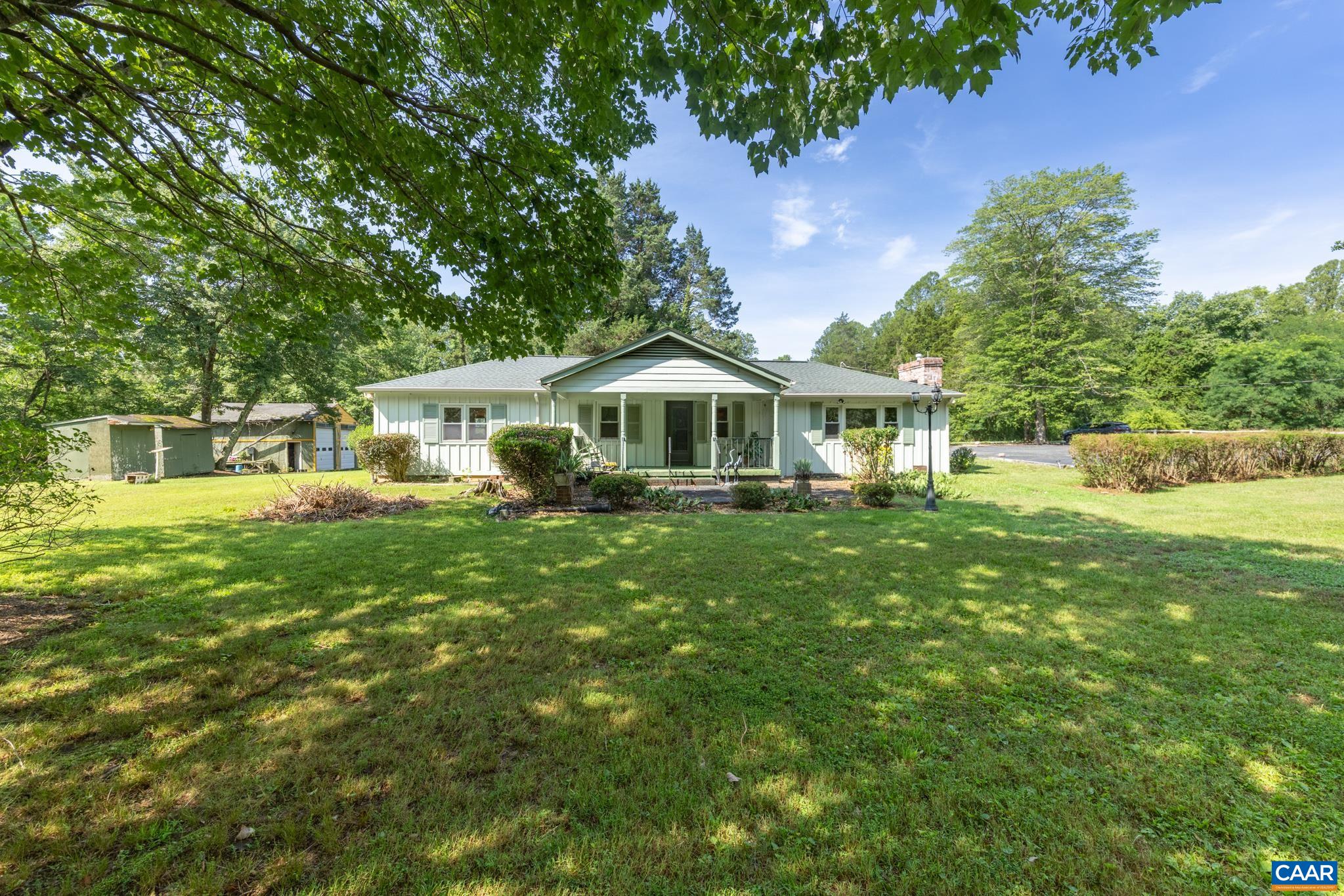Plenty of parking, covered front porch, 3 sheds, 2 car detached garage. Plenty of parking, covered front porch, 3 sheds, 2 car detached garage.