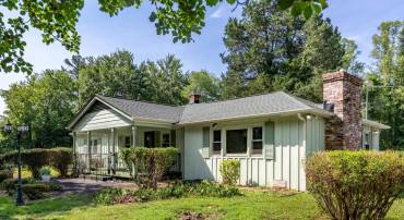 Board and batten siding. New roof 2025.