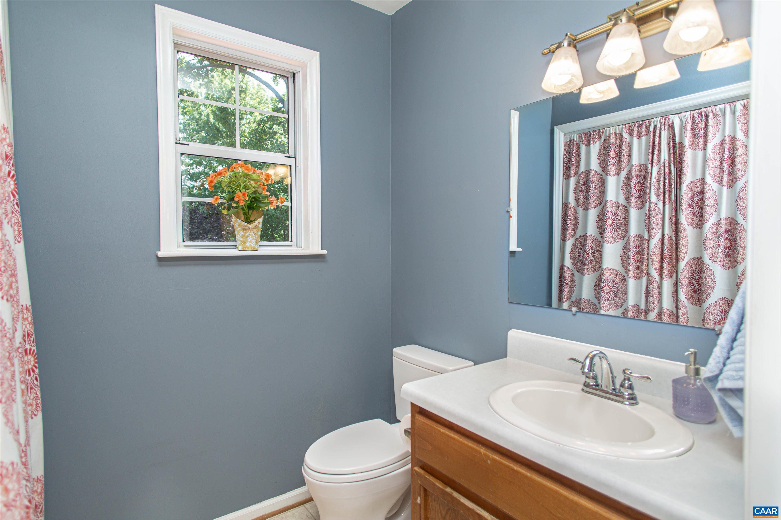 Powder room located off the living room. Powder room located off the living room.