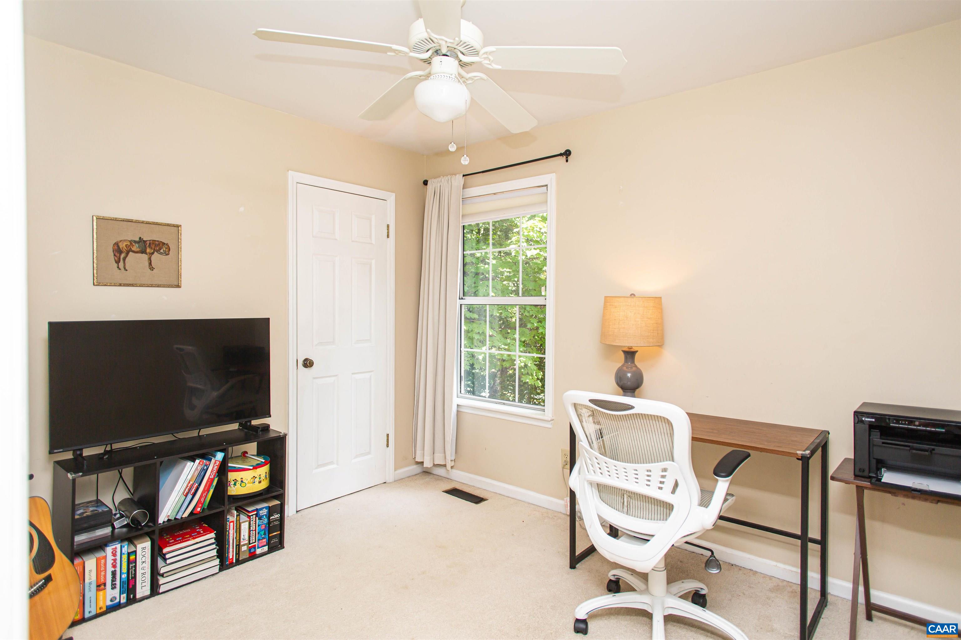 Bedroom #2 is a bright room currently used as an office/study. Bedroom #2 is a bright room currently used as an office/study.