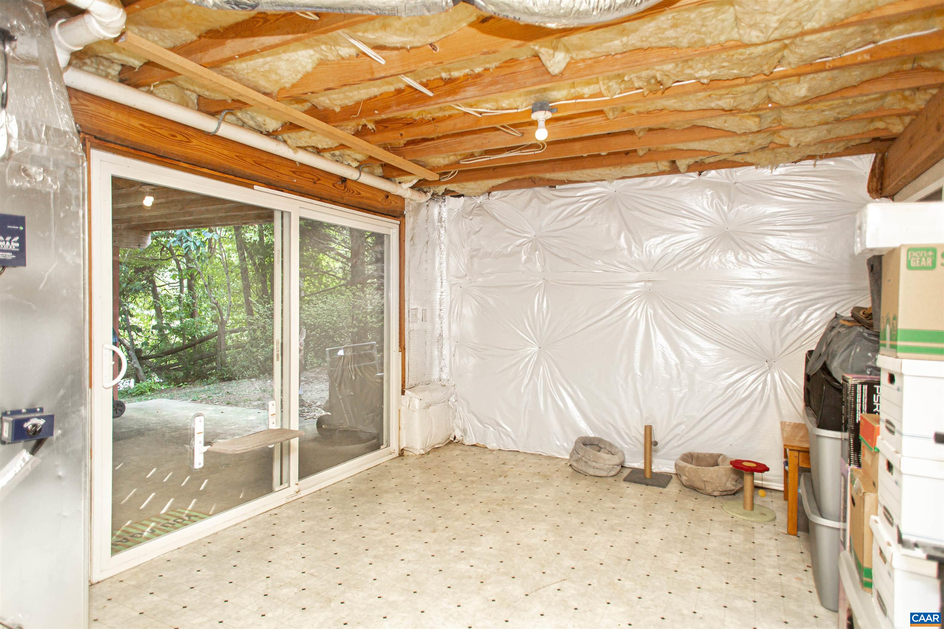 Utility/storage room is partially finished and provides access to the backyard. Utility/storage room is partially finished and provides access to the backyard.