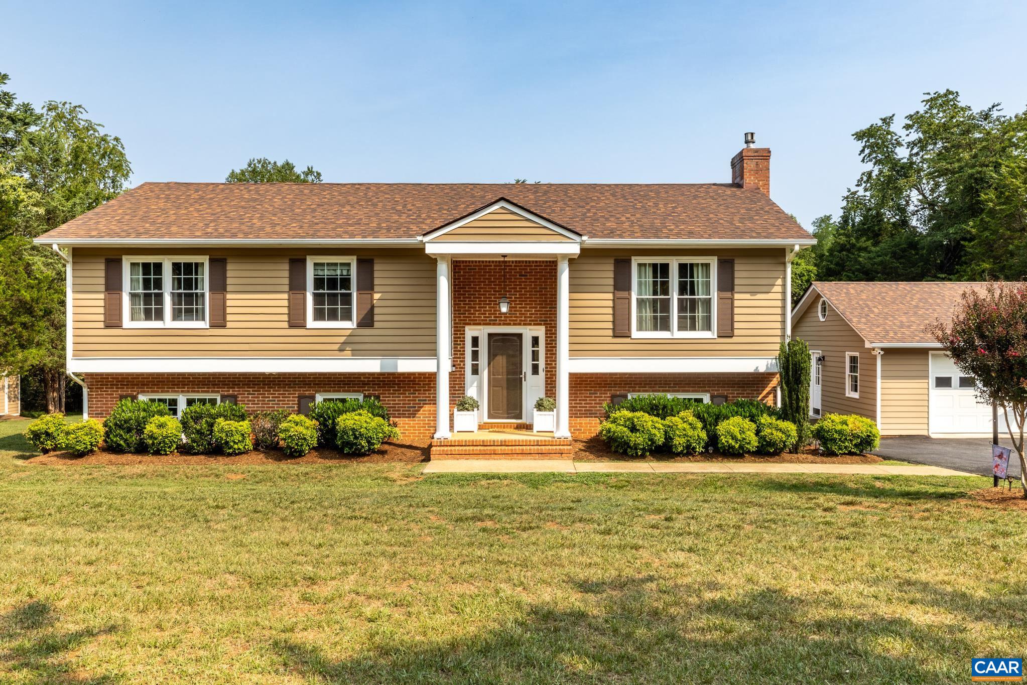 Welcome home! This stunning split-level features incredible curb appeal with cypress siding, timeless brick accents, and a lush, manicured lawn. Complete with a spacious garage, crisp white trim, and a serene, tree-lined backdrop—ready for you to move in!