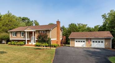 Private, picturesque country living at its finest! Stunning view showcasing a well-maintained home, expansive paved driveway, and a spacious detached garage/workshop, all surrounded by lush mature trees and a sprawling green lawn! Cypress siding is lovely