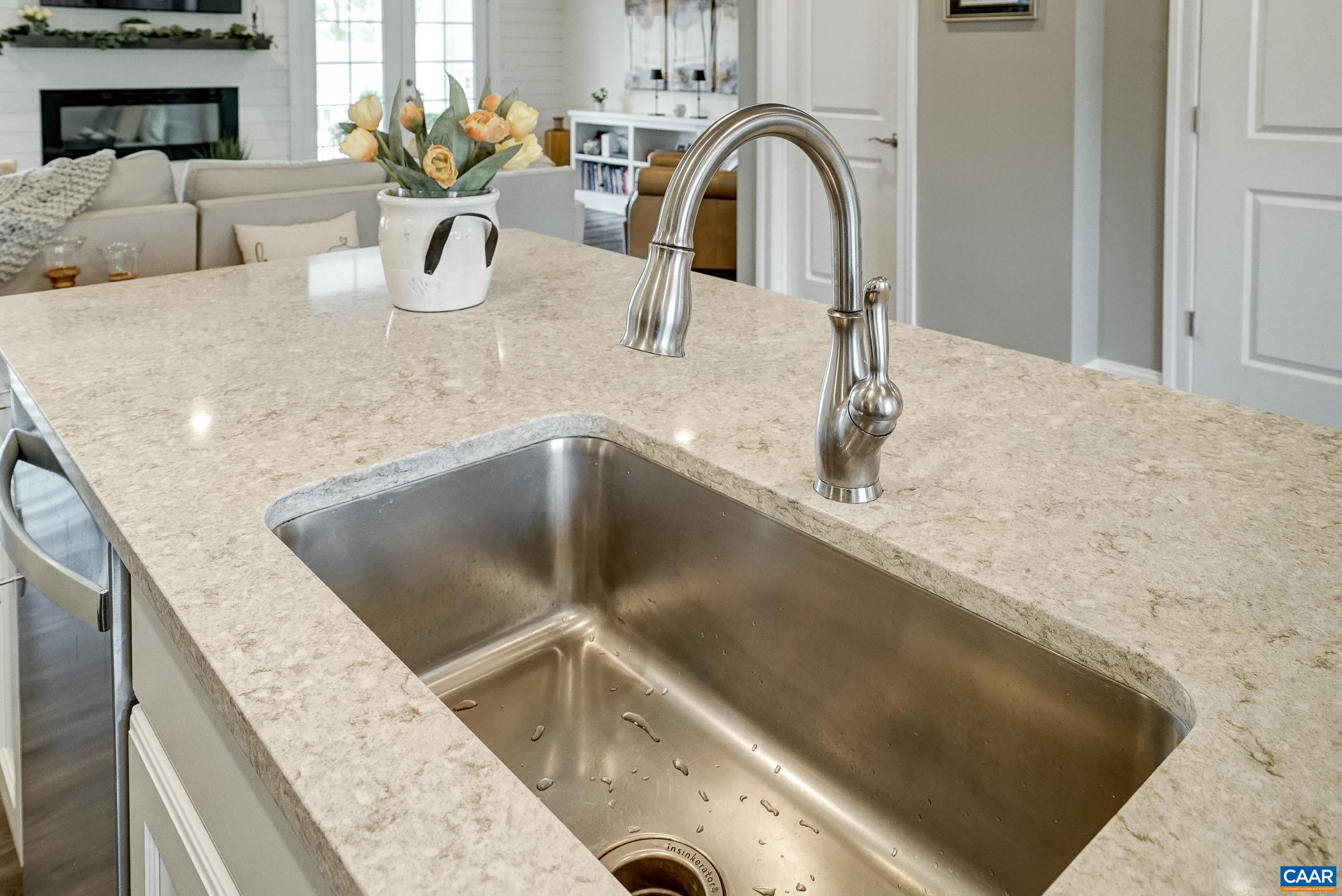 Large stainless sink in spacious island.