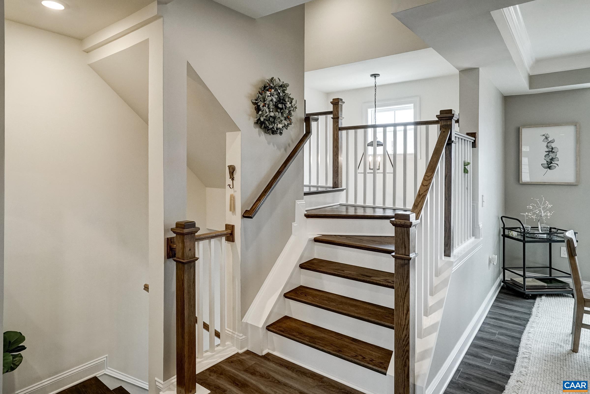 Open staircase leads to bedroom level.