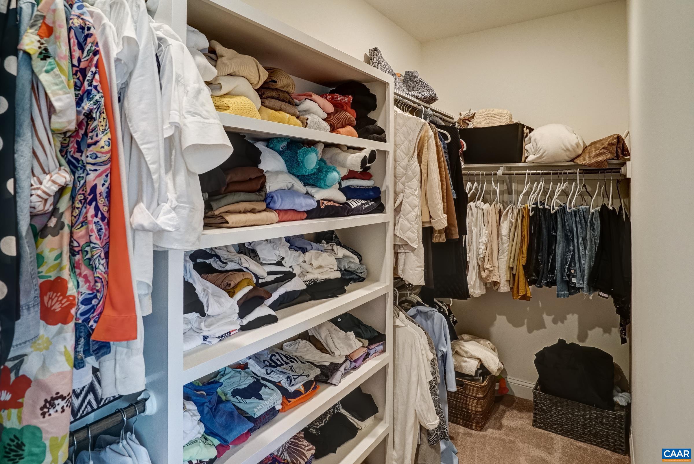 One of two custom walk-in closets.