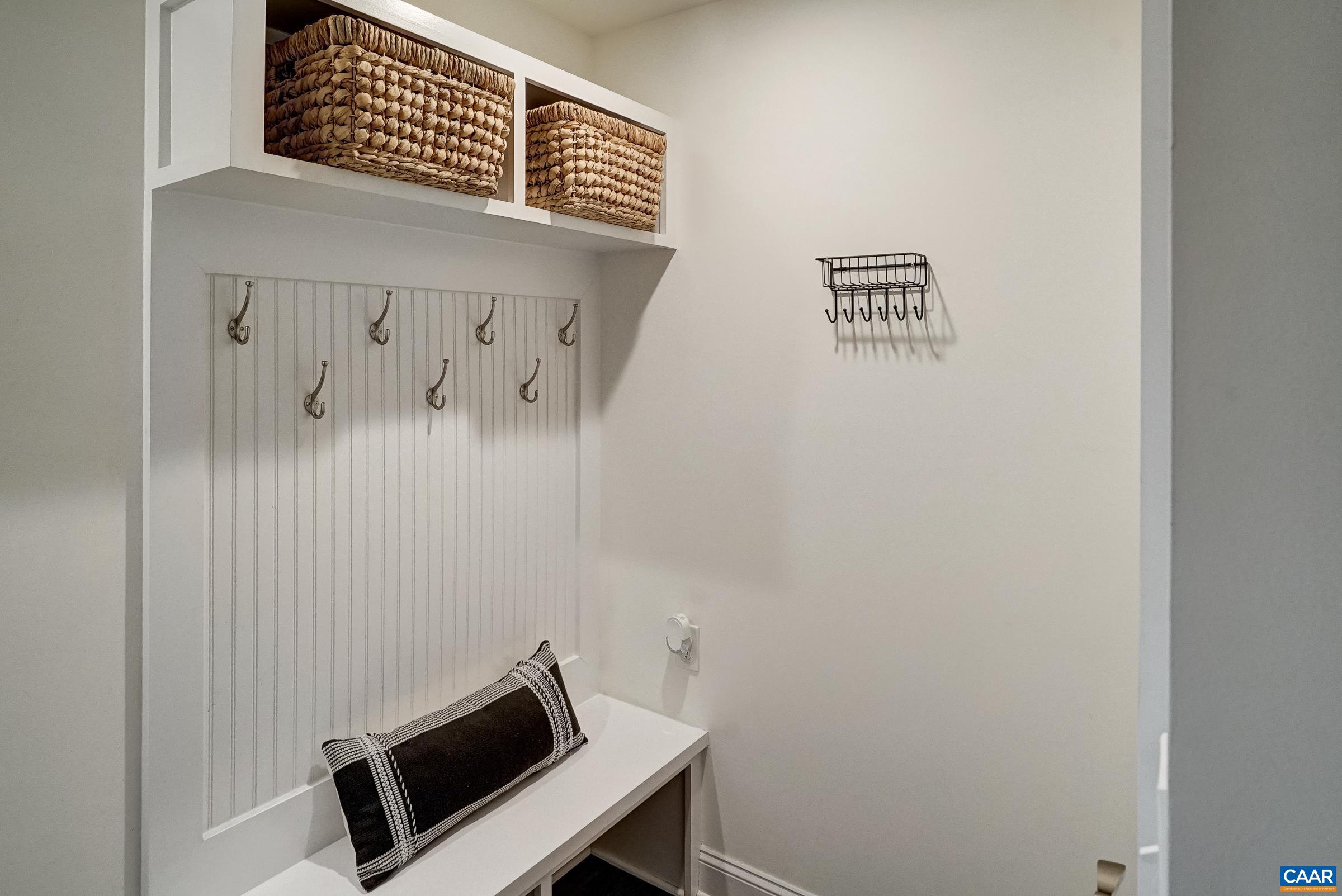 Built-in bench with storage in mudroom.