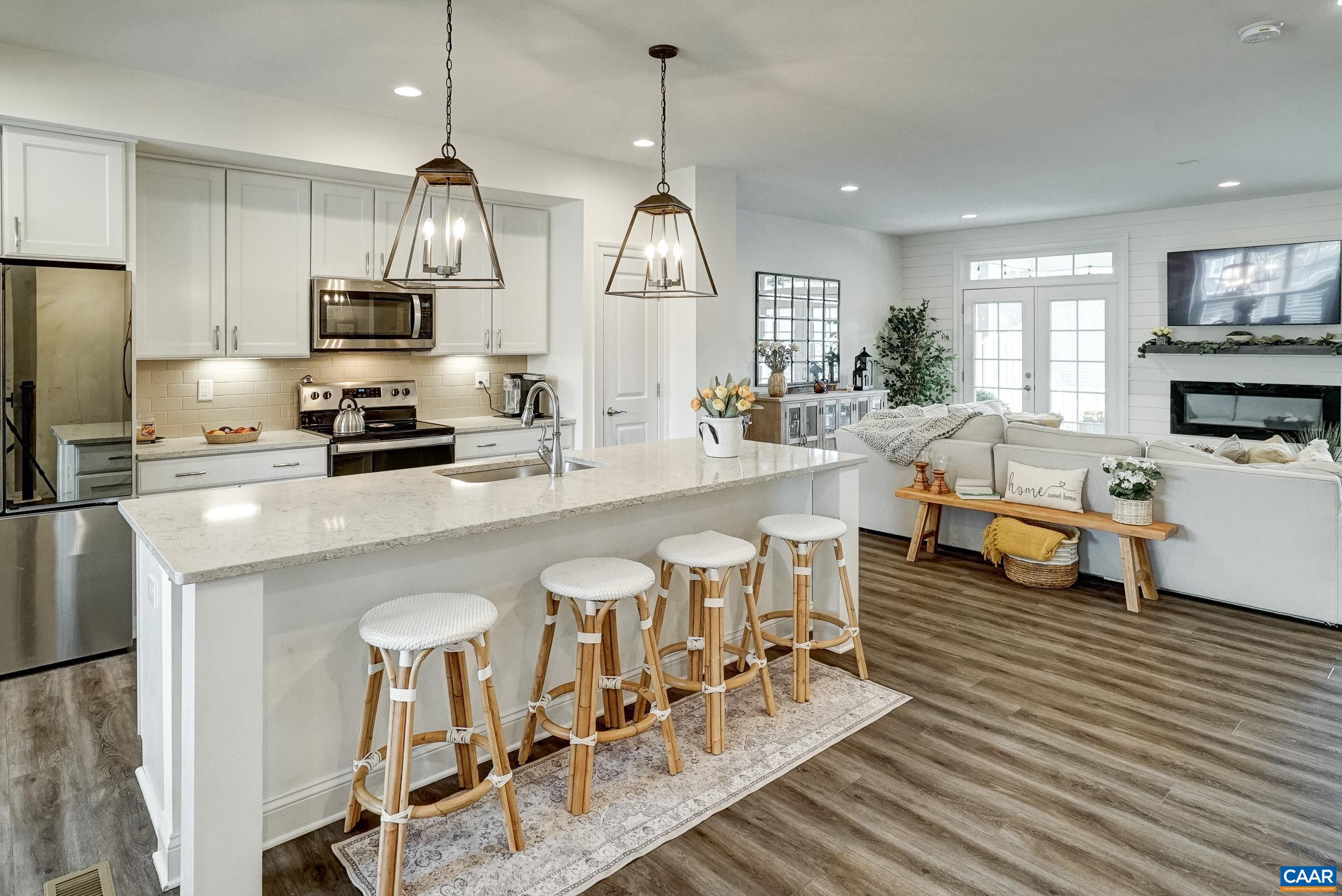 Open floor plan on the main level features luxury vinyl flooring.