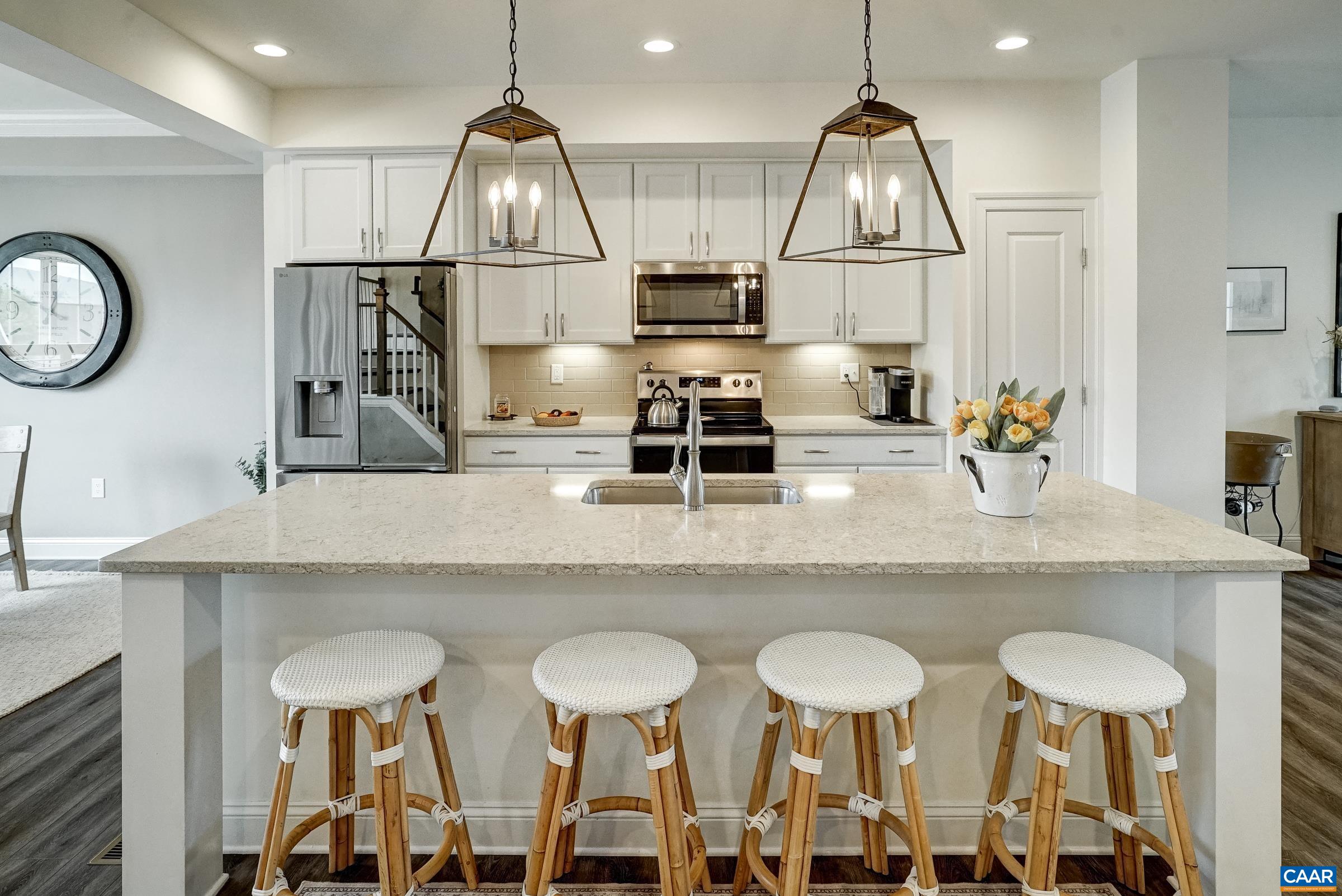 Gourmet kitchen with quartz countertops.