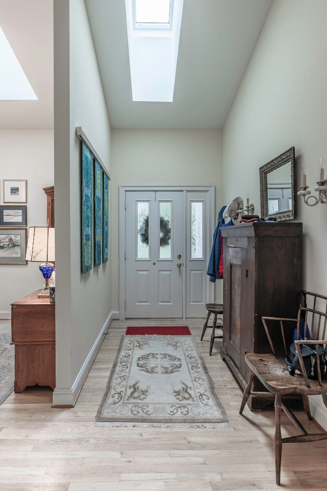 Inside, you’ll find hardwood floors, vaulted ceilings, and skylights (replaced in 2021) that fill the home with natural light. Inside, you’ll find hardwood floors, vaulted ceilings, and skylights (replaced in 2021) that fill the home with natural light.