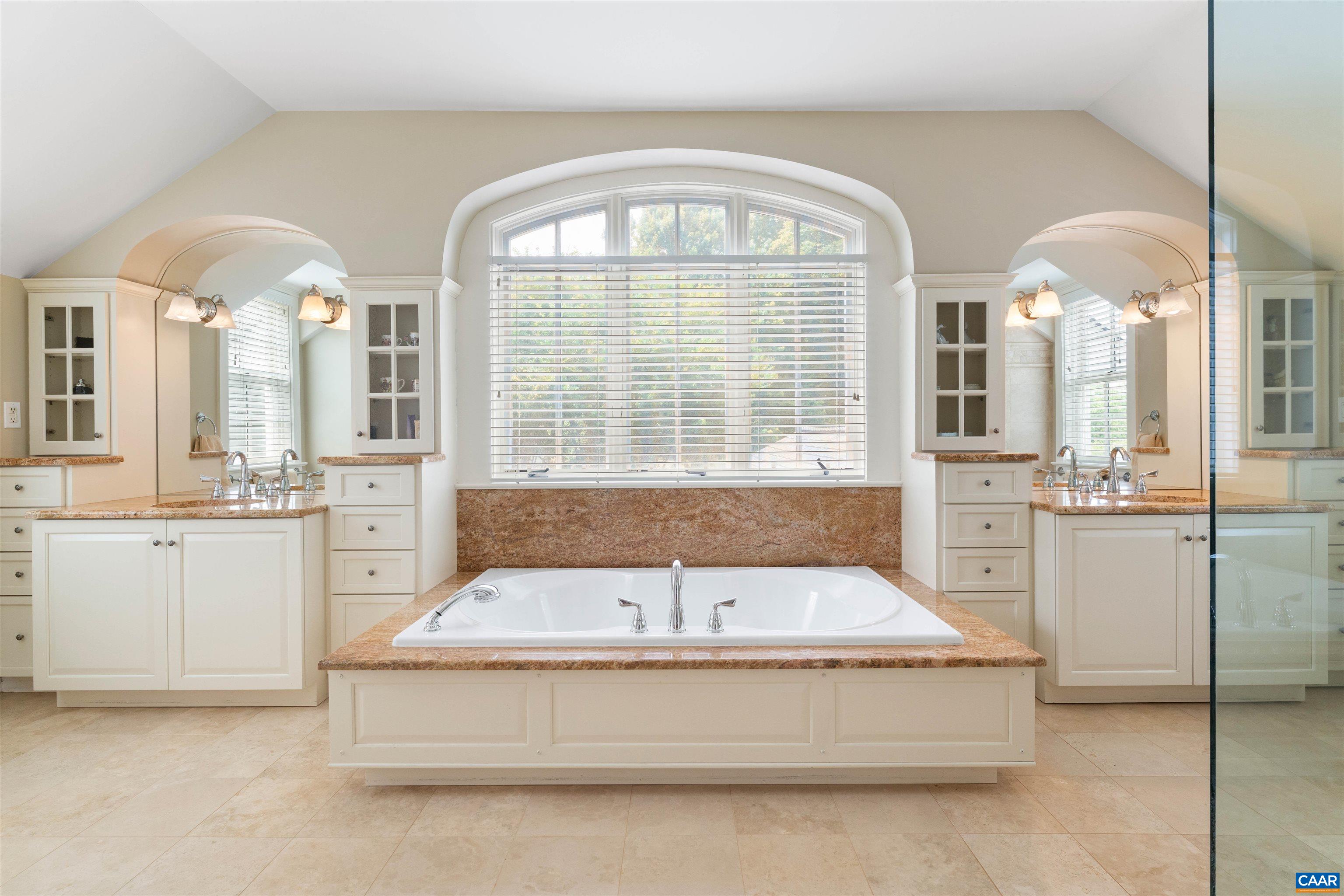 Double vanities, soaking tub & glassed shower. Double vanities, soaking tub & glassed shower.