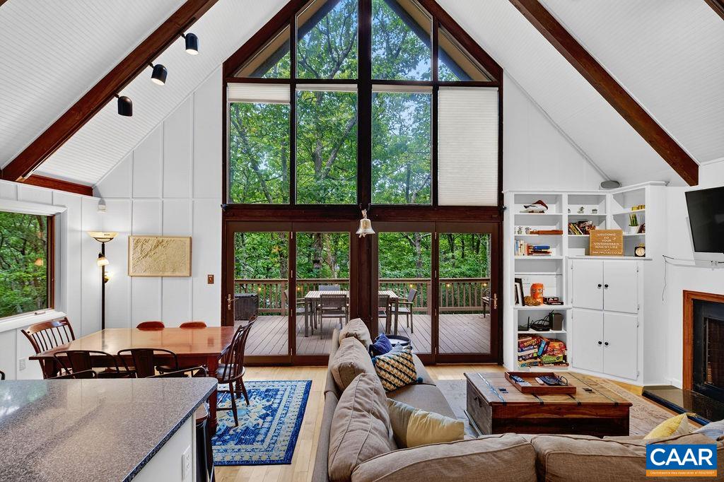 Enjoy the airy, open-concept A-frame layout that unites the great room, dining area, and kitchen into one inviting living space