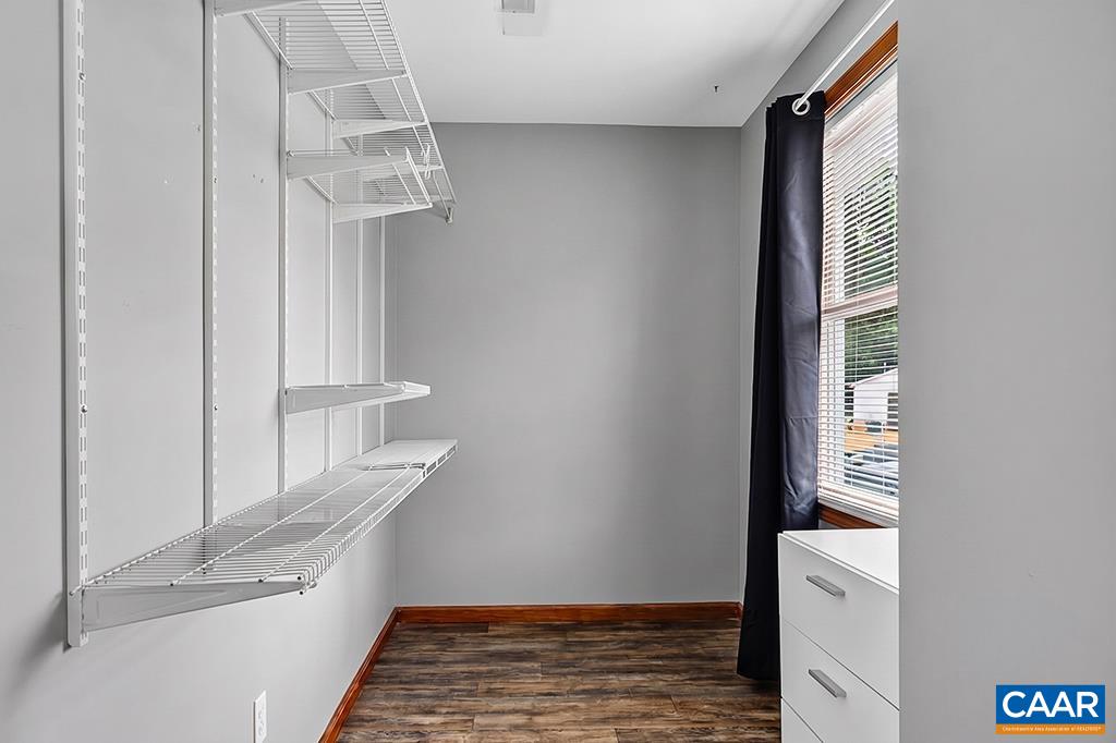 This good sized storage area in the primary bedroom could easily be transformed into a second walk-in closet.