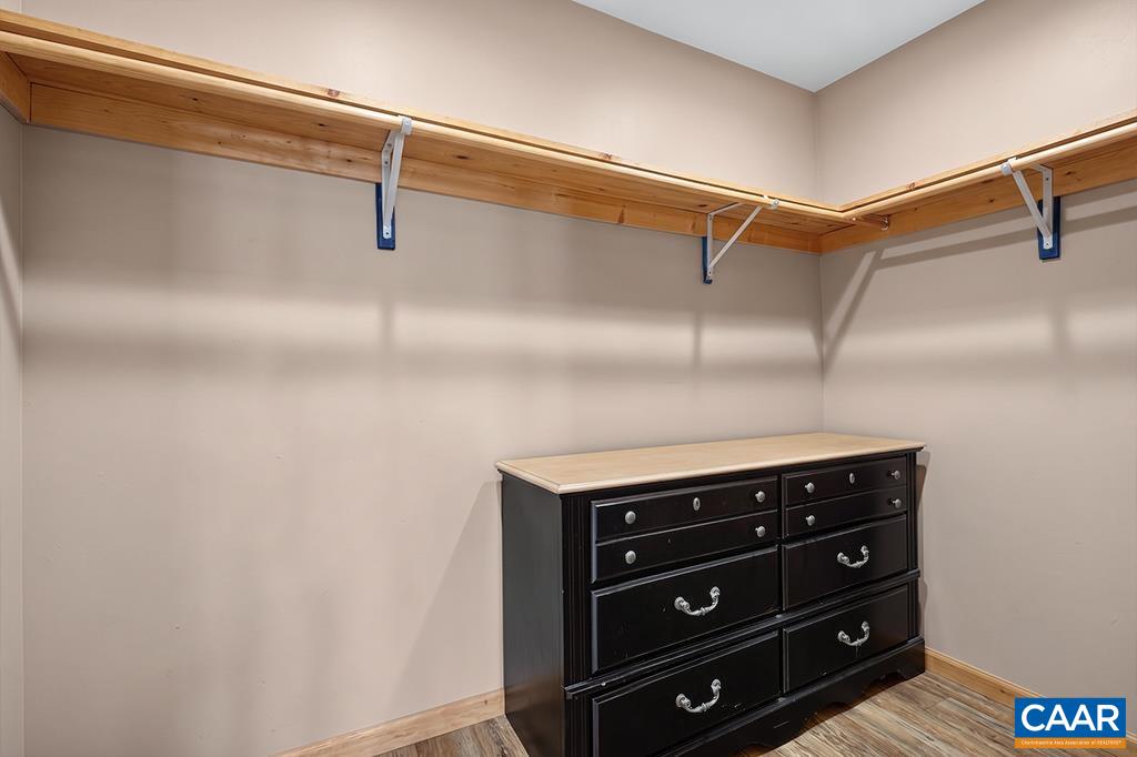 Primary bedroom walk-in closet
