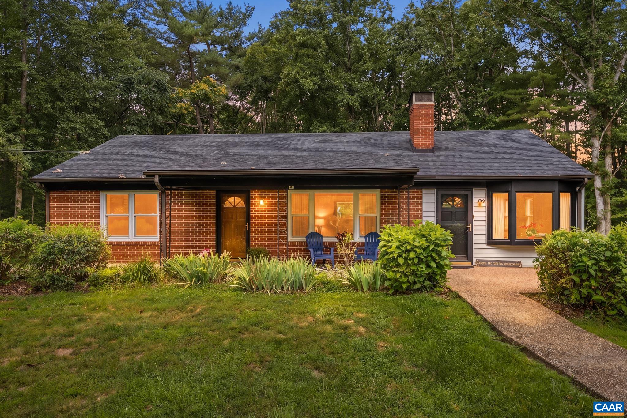 Welcome to this sprawling brick ranch where country charm meets timeless comfort.