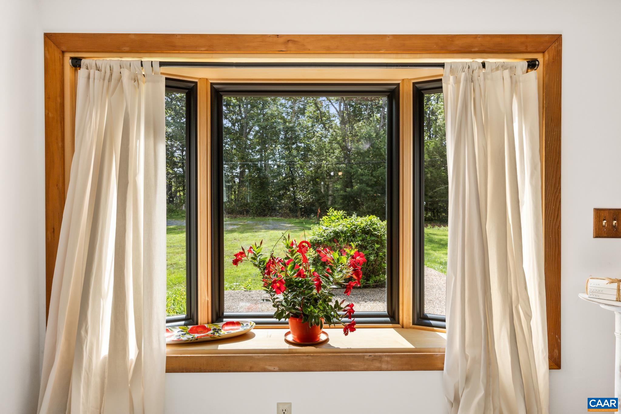 Natural light and peaceful views. This charming bay window creates the perfect spot to enjoy your morning coffee while overlooking the beautiful backyard.