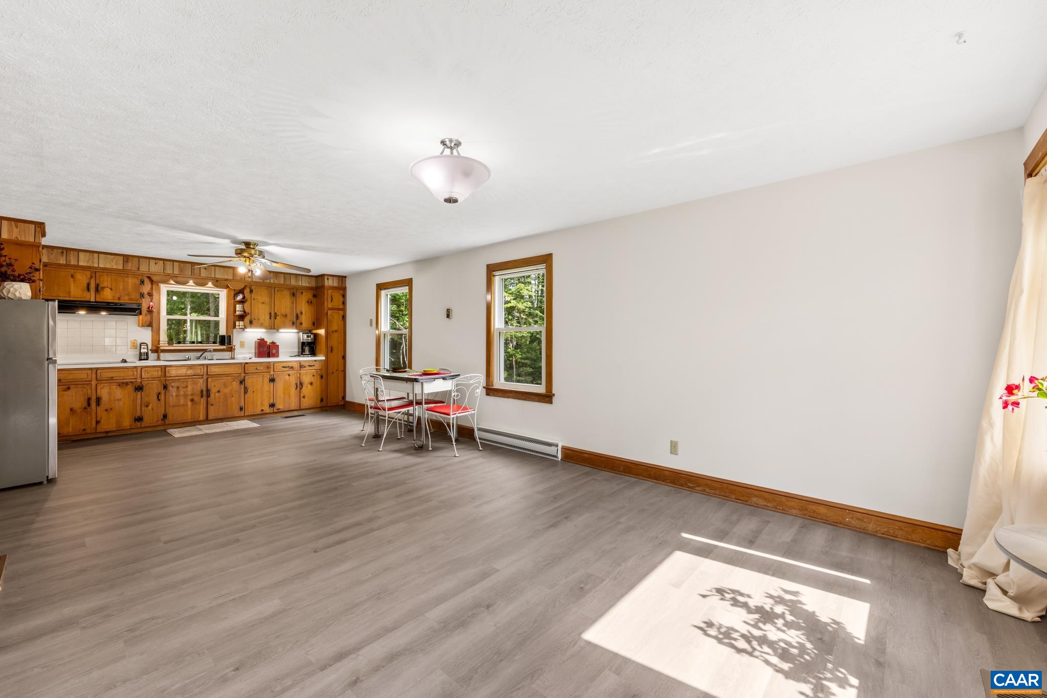 The open-concept kitchen and dining area creates a seamless flow, making it easy for entertaining guests, host holiday meals or enjoy everyday family gatherings.