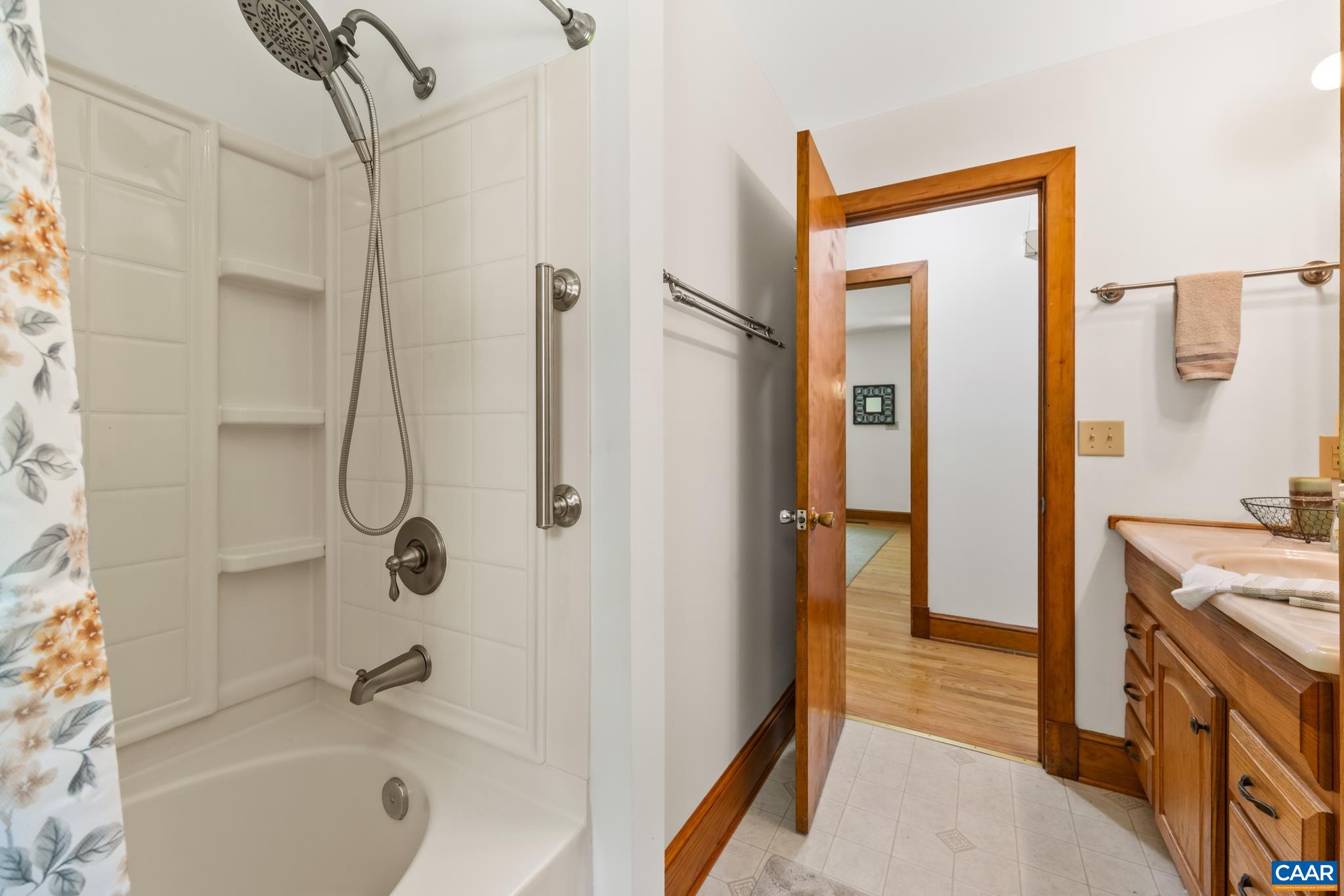 Convenient first-floor full bath featuring a tub/shower combination.