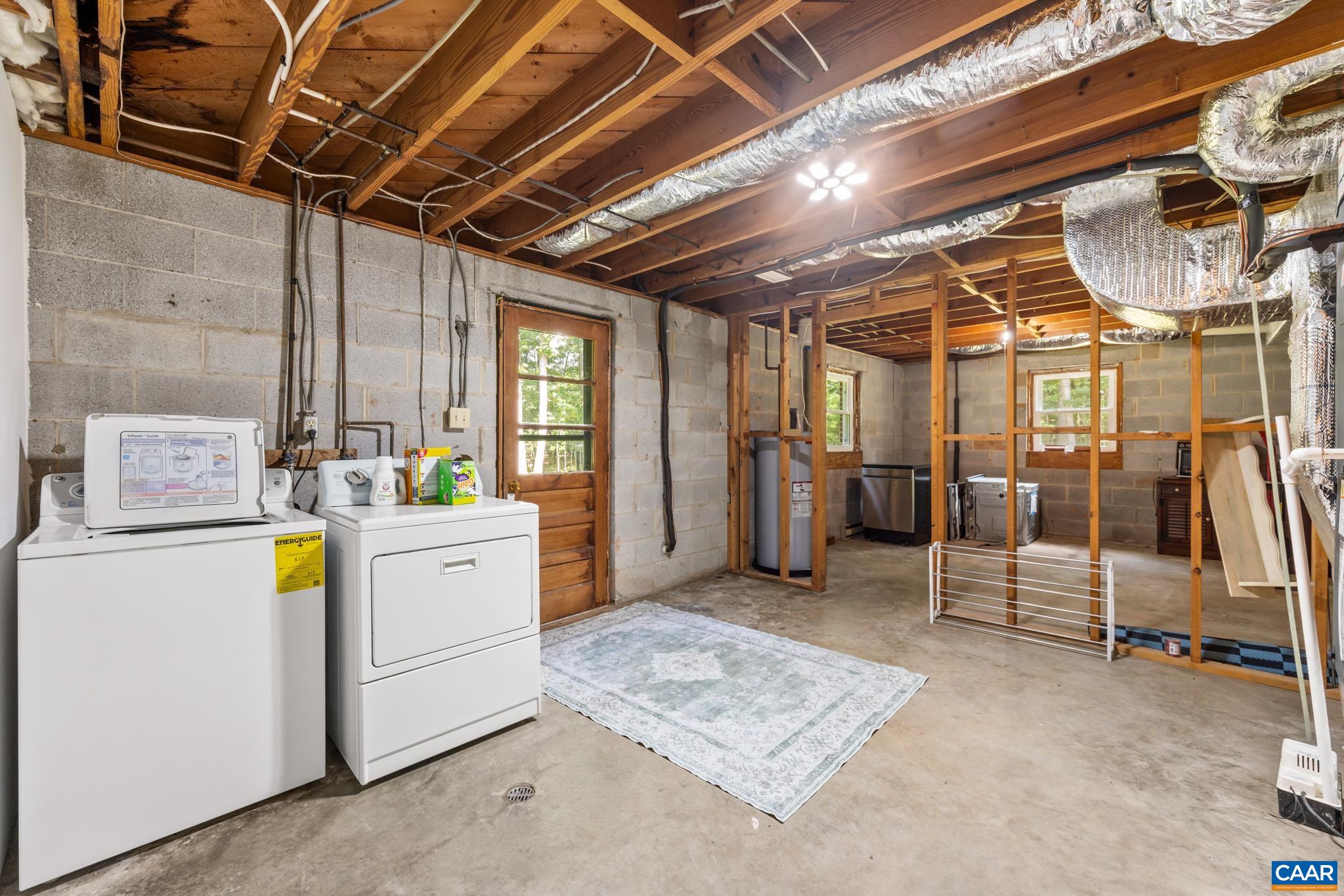 Functional laundry and mechanical offering convenient utility space along with abundant additional storage. A practical area designed to keep everyday essentials organized while providing plenty of room for seasonal tools and household needs.