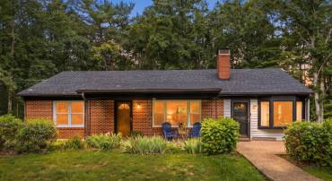 Welcome to this sprawling brick ranch where country charm meets timeless comfort.