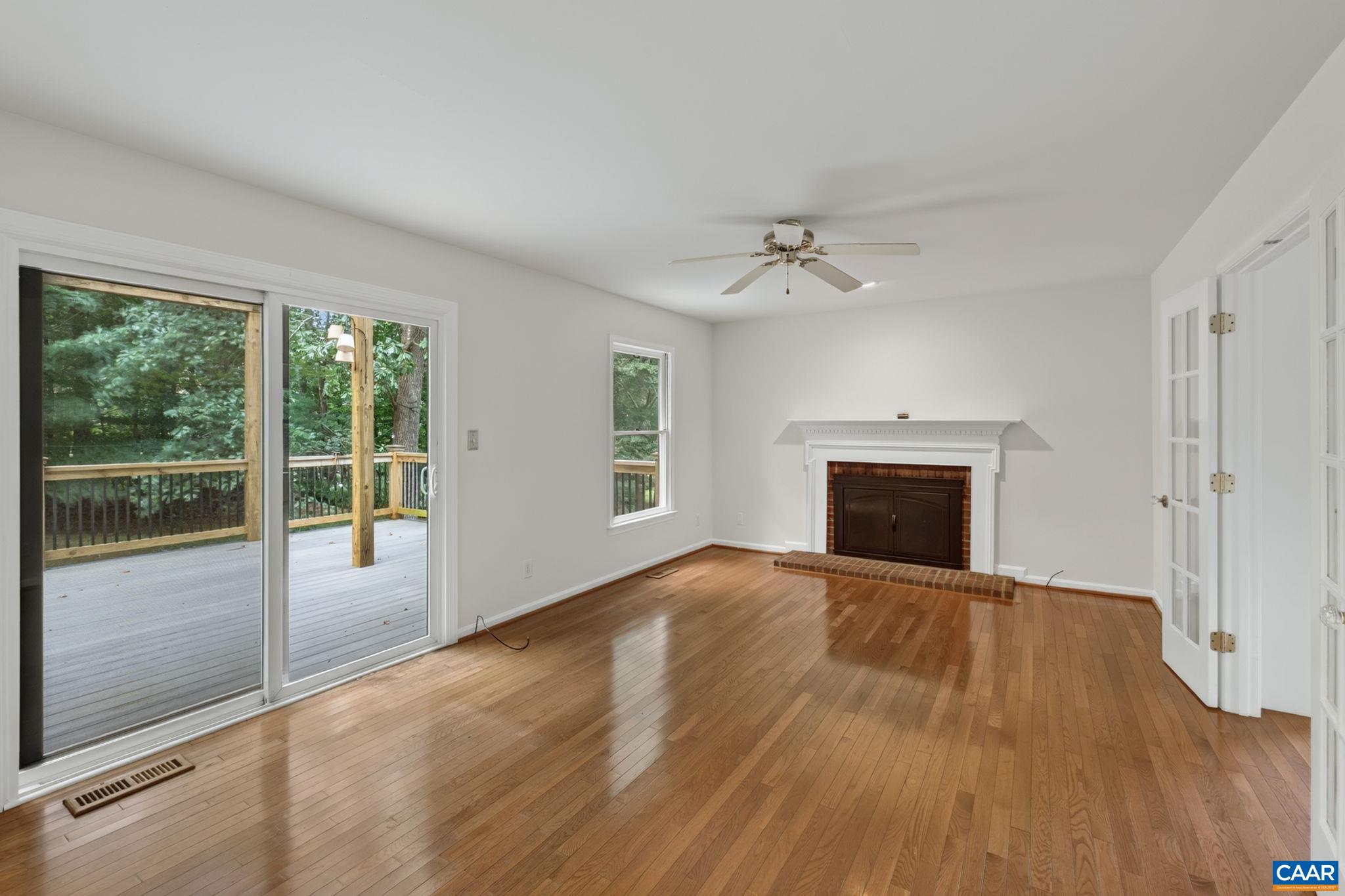Located on the rear of the home is a spacious family room with hardwood flooring, access to the rear deck, and a cozy wood-burning fireplace!