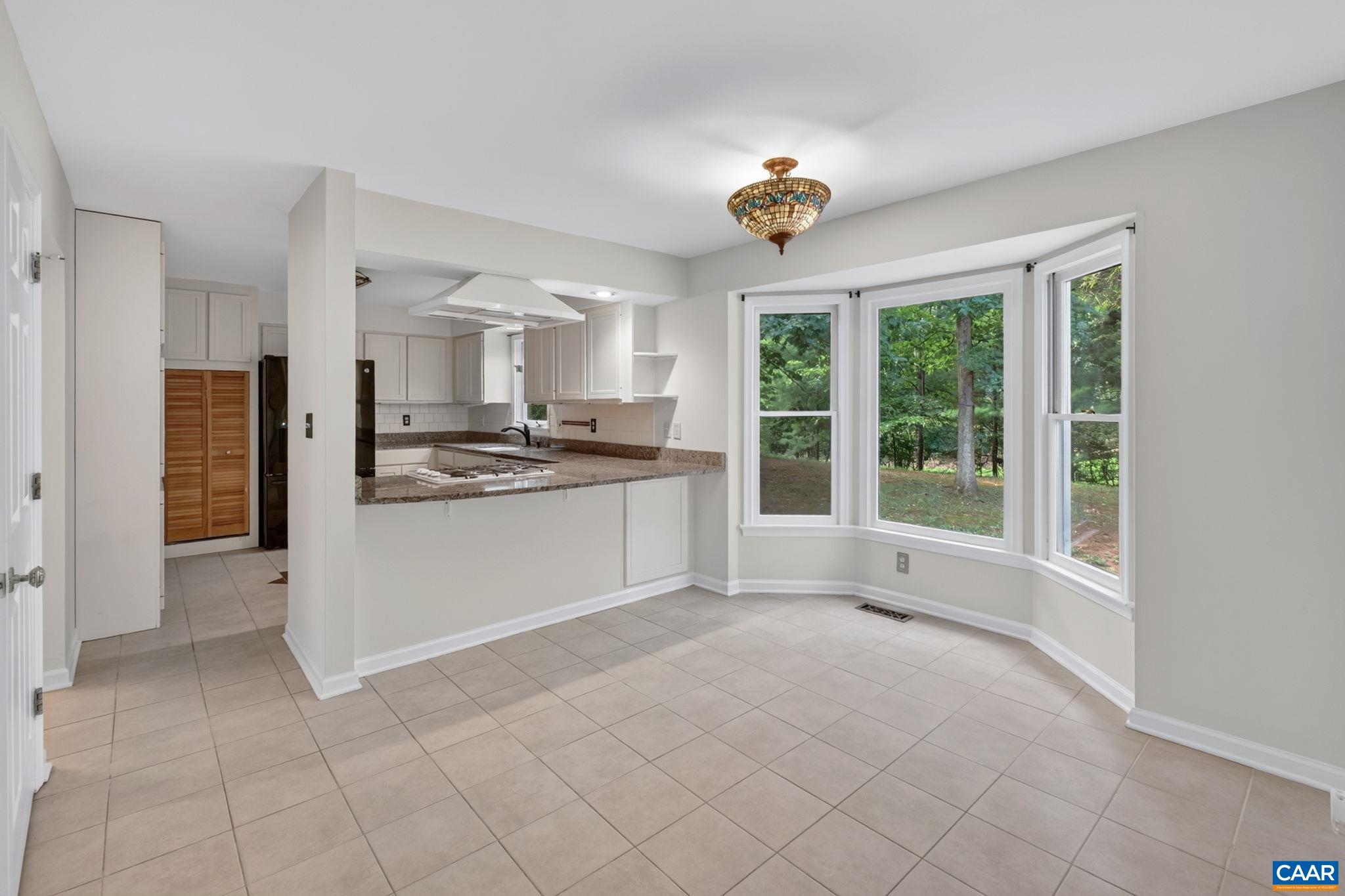 You'll love this bright & cheery space in the kitchen! The bay window allows for natural light to pour in!