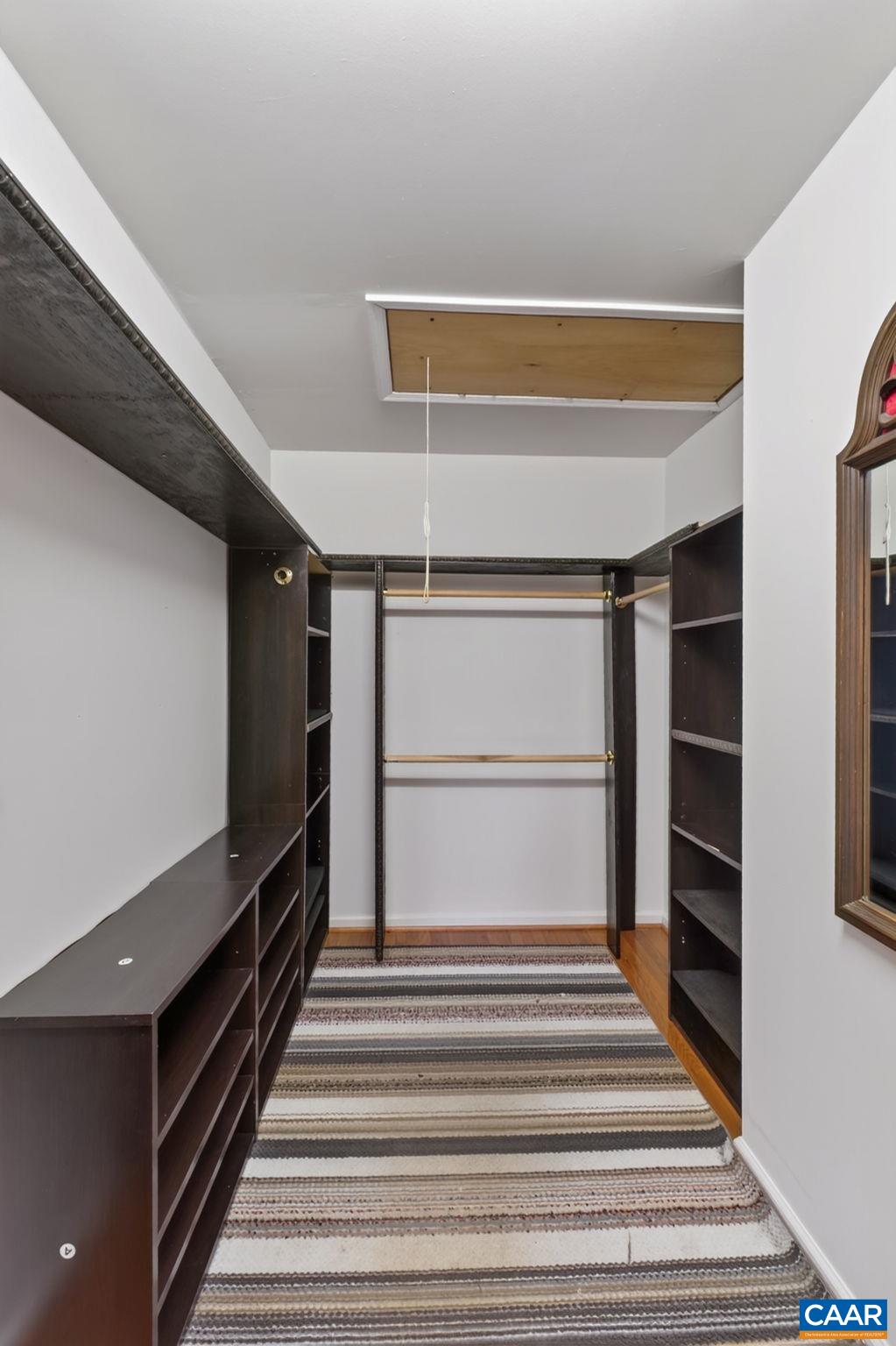 Enjoy this customized walkin closet in the primary bedroom!