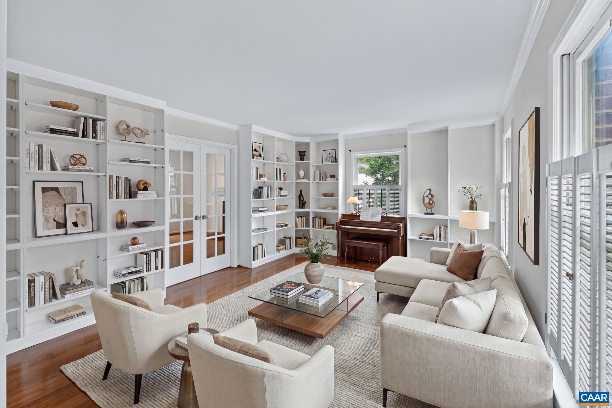 This is just one of many ways to use this space in the living room fitted with builit-in bookcases. Let your imagination run wild!