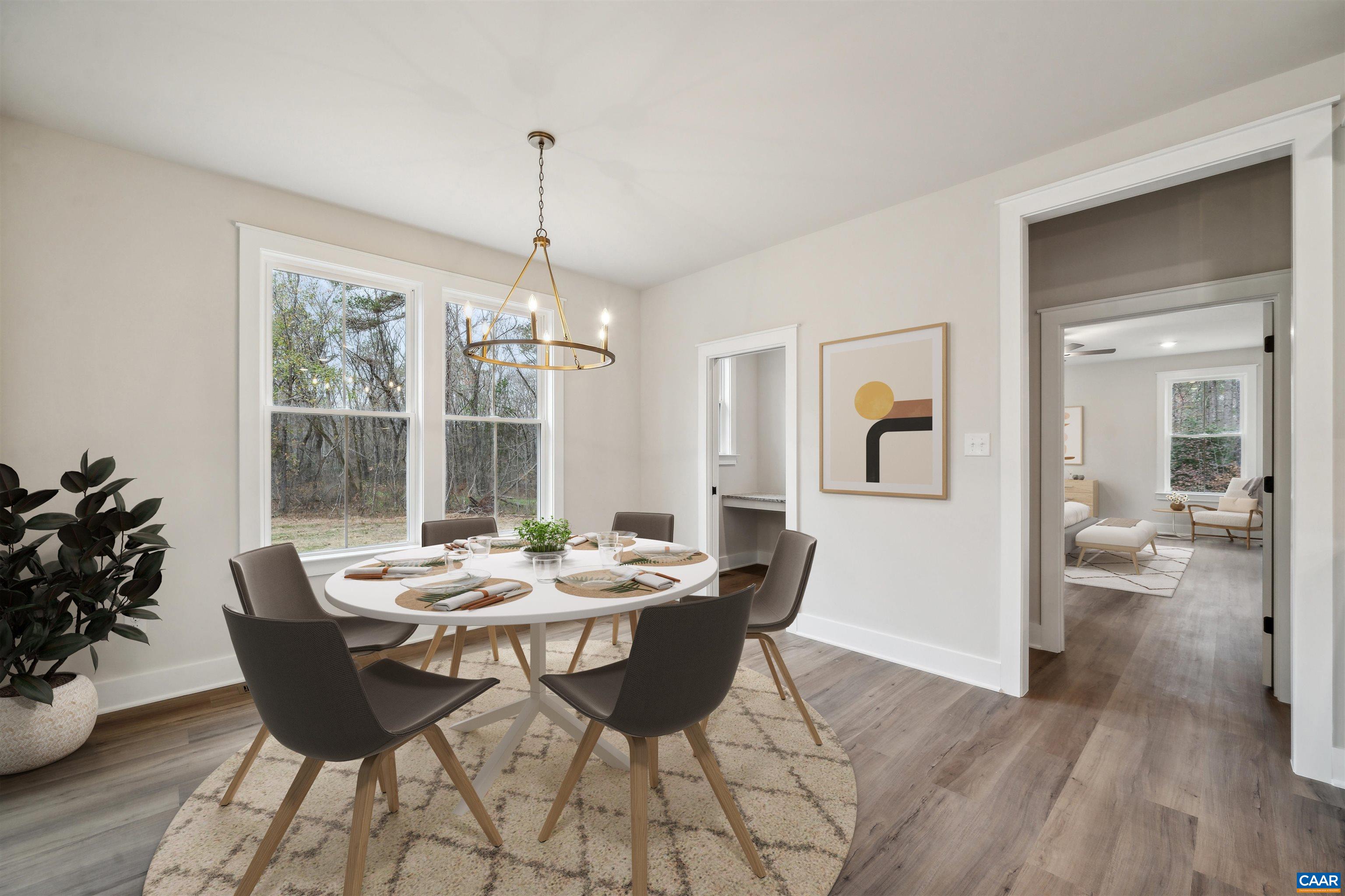 Adjacent to kitchen. A peek into the pocket office, primary suite. Virtually Staged