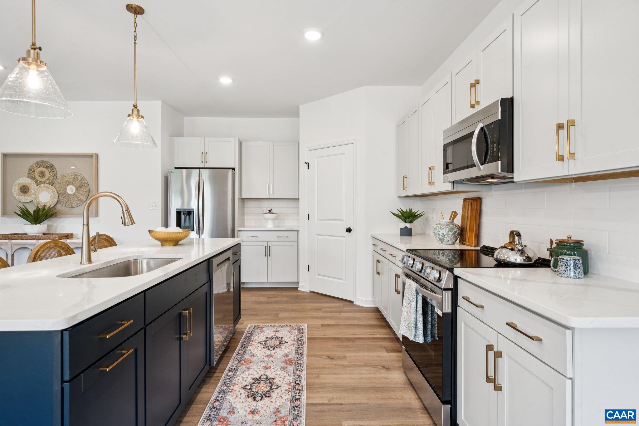 Walk-In Pantry, SS dishwasher, microwave and slide-in range. Model Home