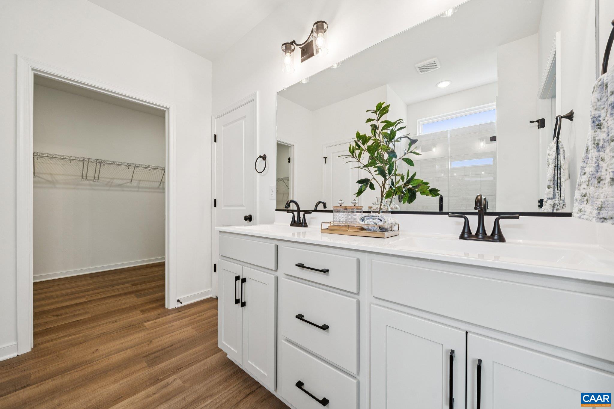 Tile shower, options for soaking tub, linen closet, private water closet, LARGE walk-in closet.