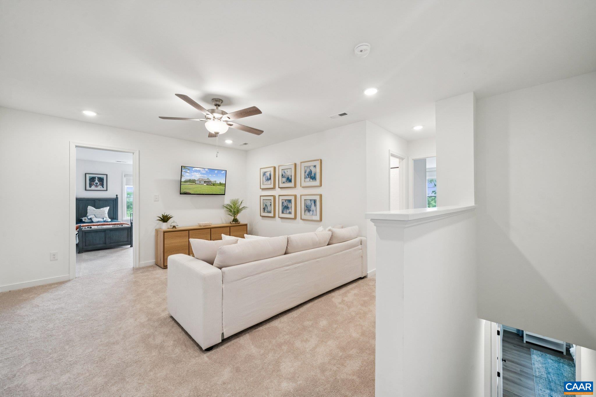 Great space for kids or second living space. View to optional bedroom (for a total of 3 Upstairs Bedrooms). Model Home.