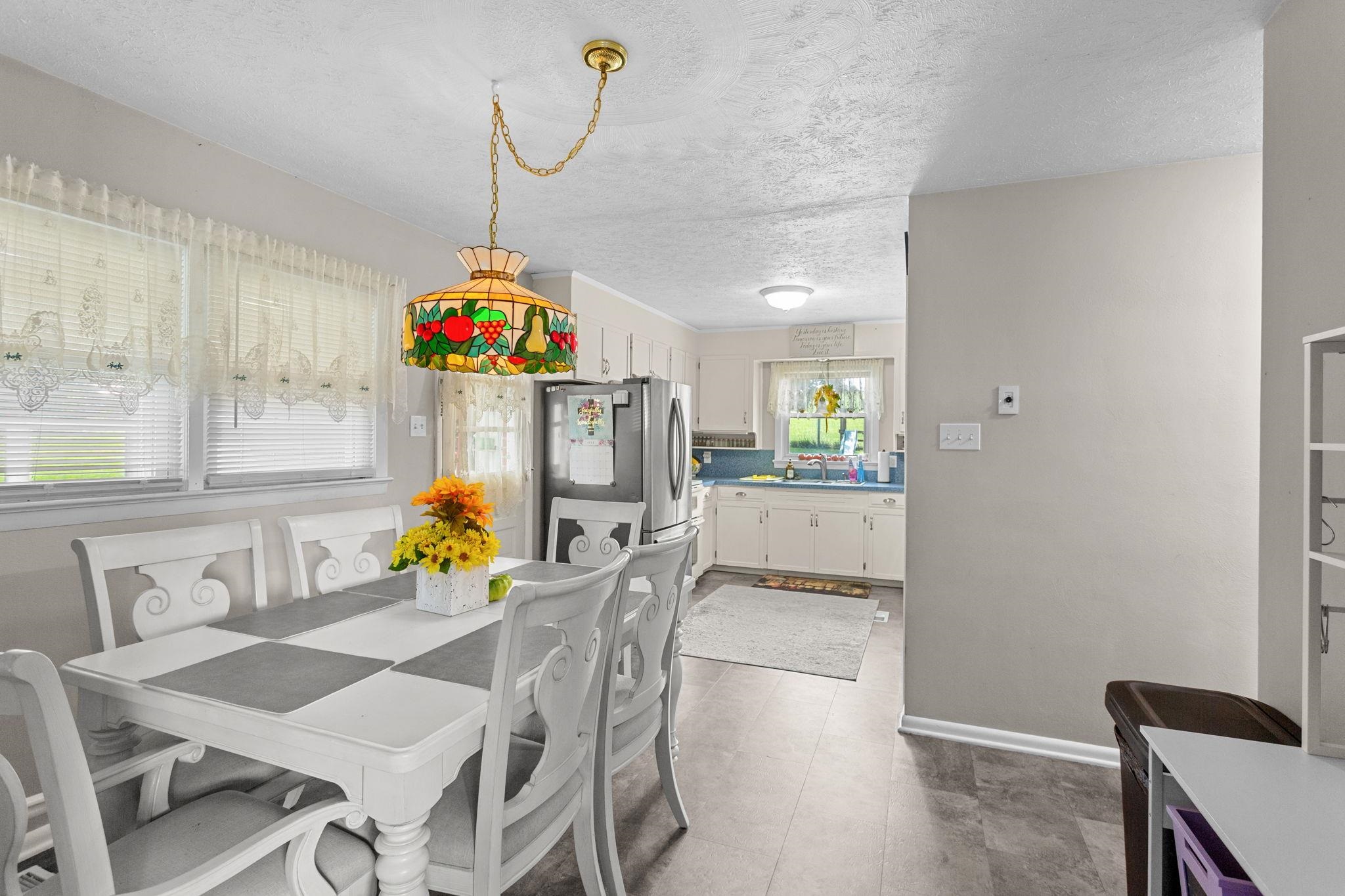 looking into kitchen area and has a door to the carport. looking into kitchen area and has a door to the carport.