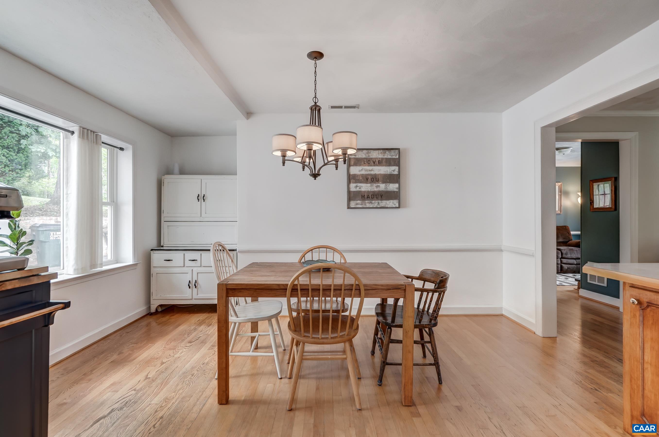 Dining area with large picture window. Dining area with large picture window.