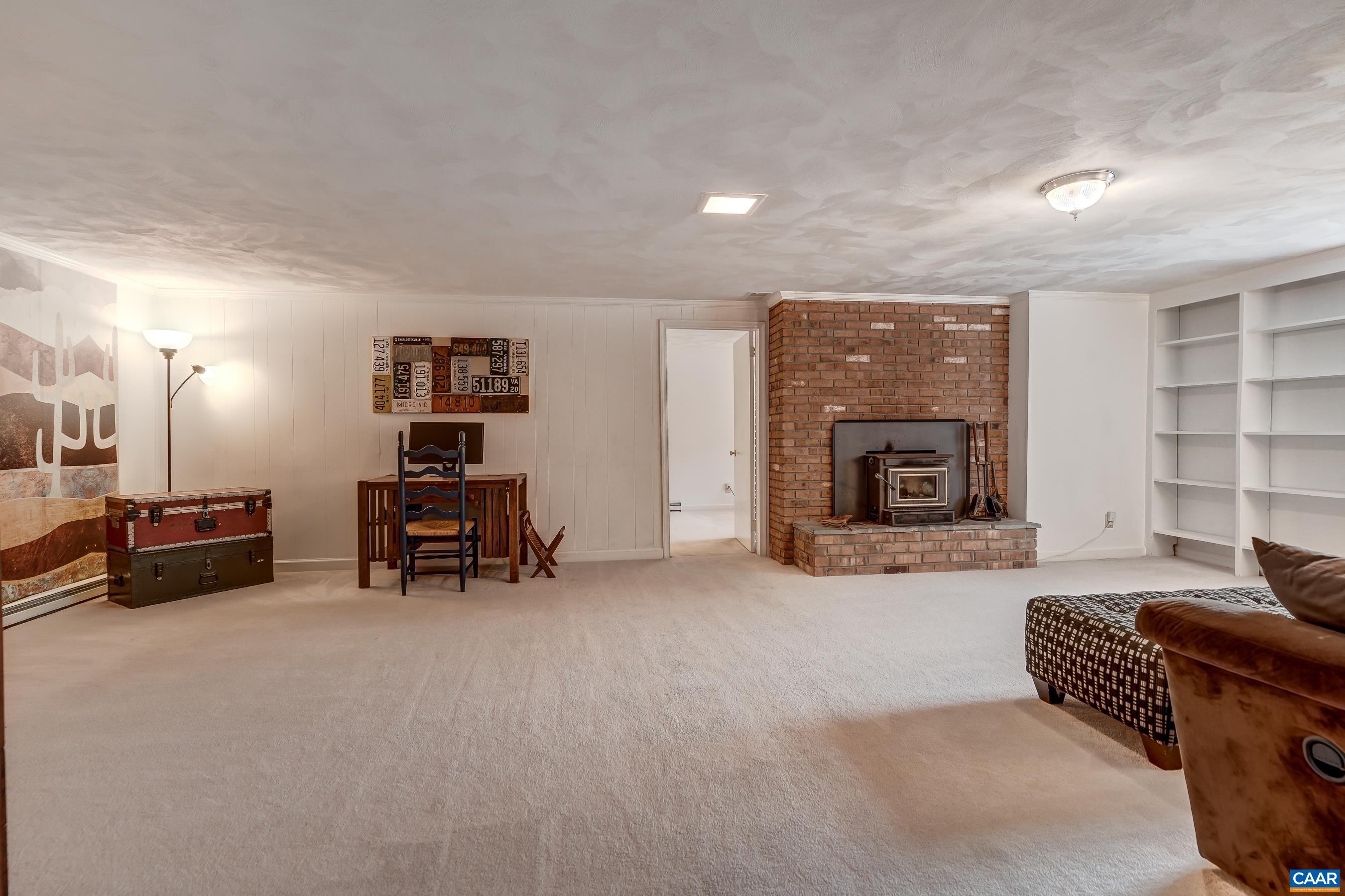 Large rec room with wood stove and built-ins Large rec room with wood stove and built-ins
