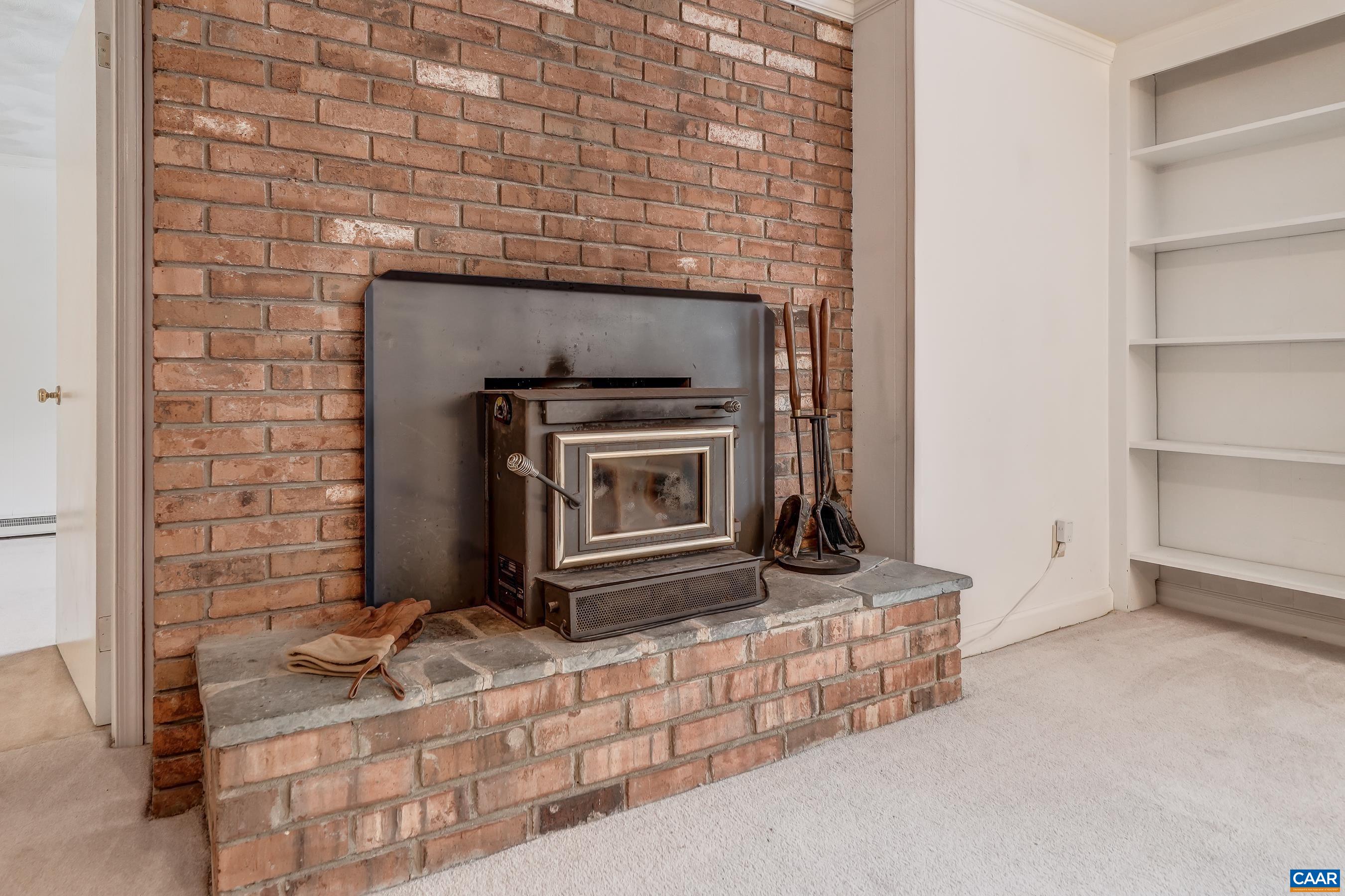 Brick fireplace with wood-stove Brick fireplace with wood-stove