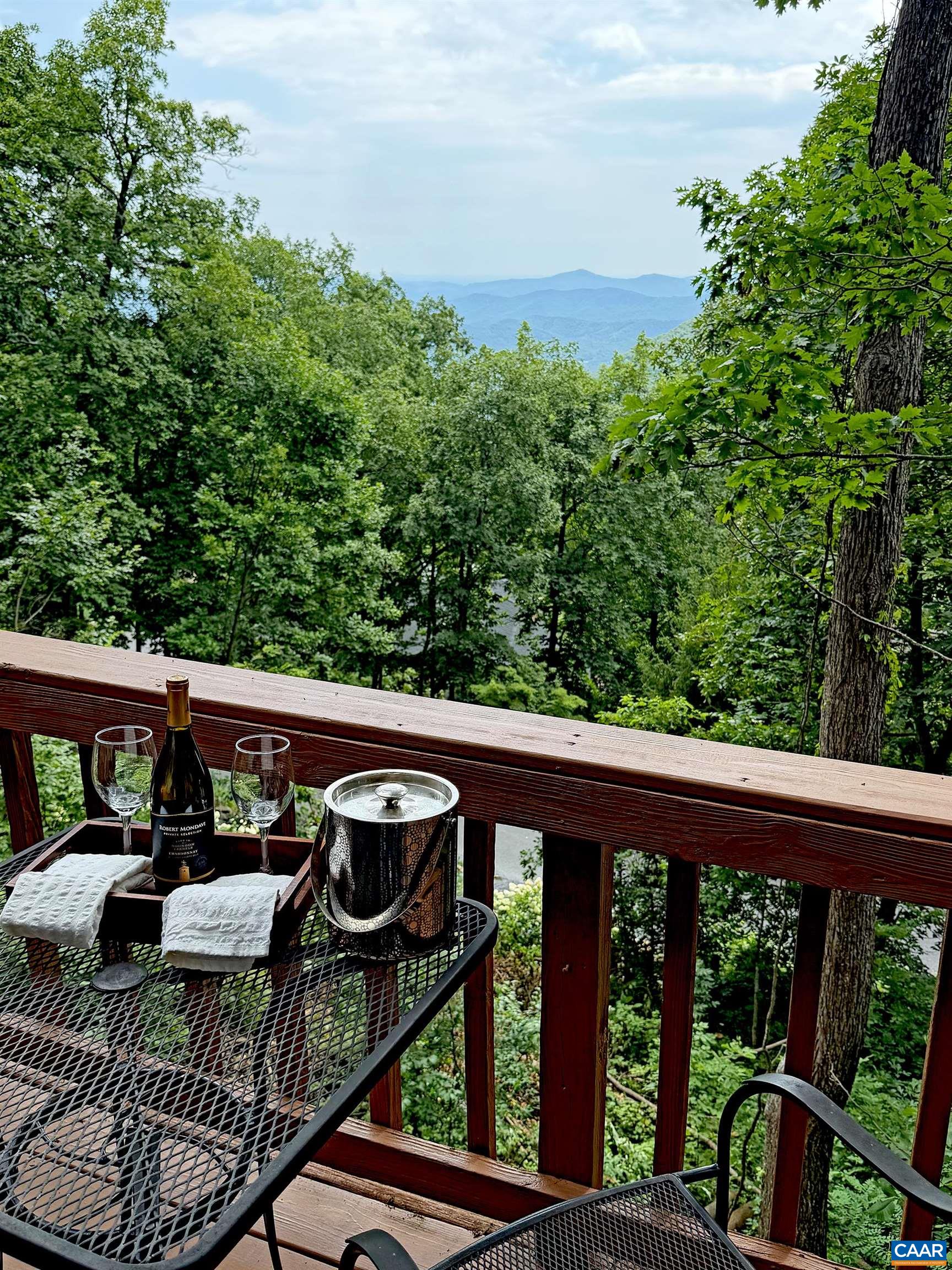 Step onto the private balcony off the primary bedroom and enjoy beautiful year-round southern mountain views. Step onto the private balcony off the primary bedroom and enjoy beautiful year-round southern mountain views.