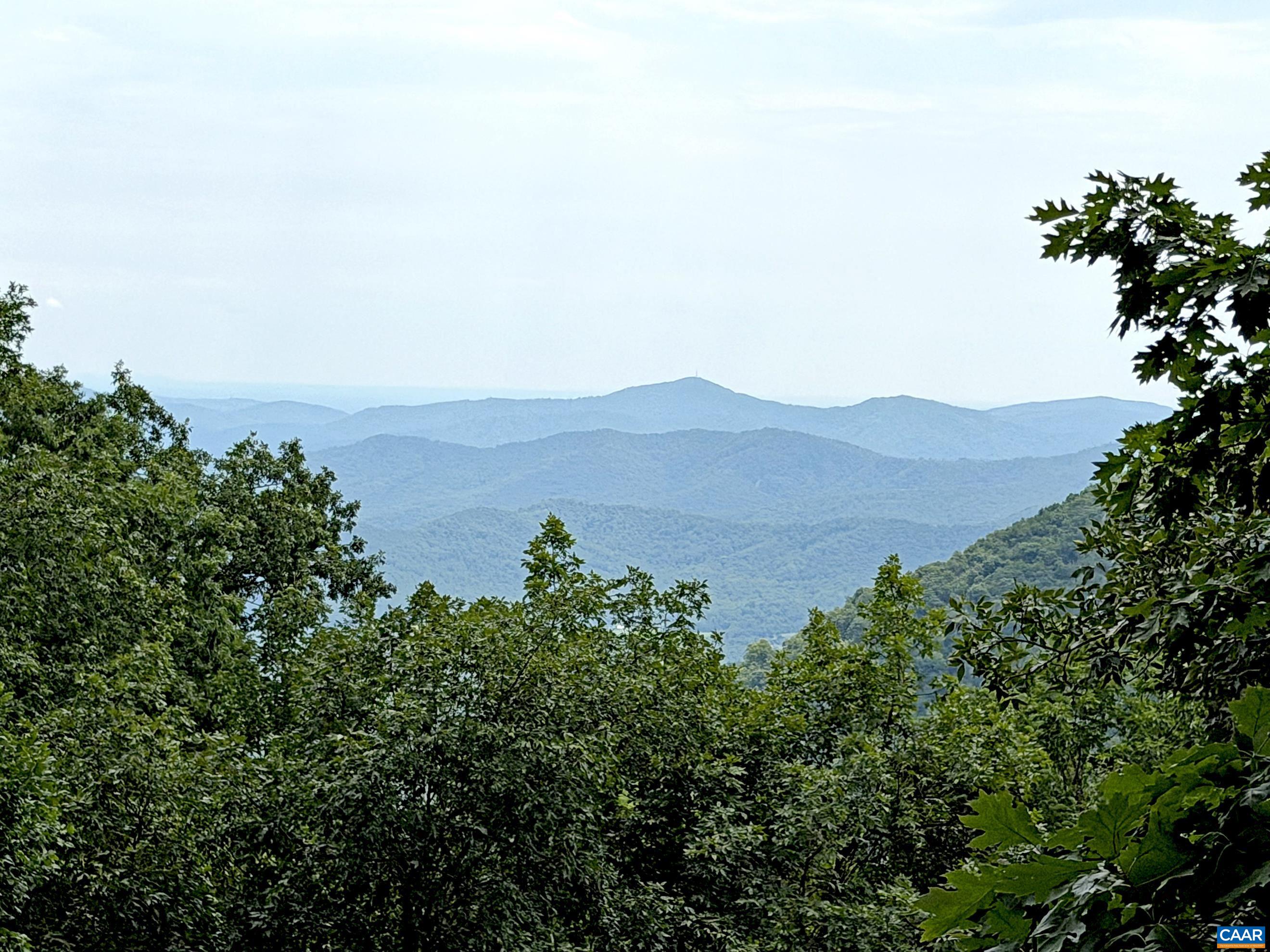 The primary bedroom enjoys beautiful summer mountain views that become even more breathtaking from early November through early May. The primary bedroom enjoys beautiful summer mountain views that become even more breathtaking from early November through early May.