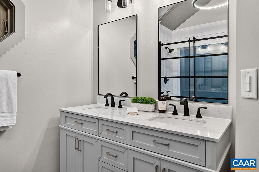Luxurious primary bathroom with elegant finishes and a spa-like feel. Luxurious primary bathroom with elegant finishes and a spa-like feel.