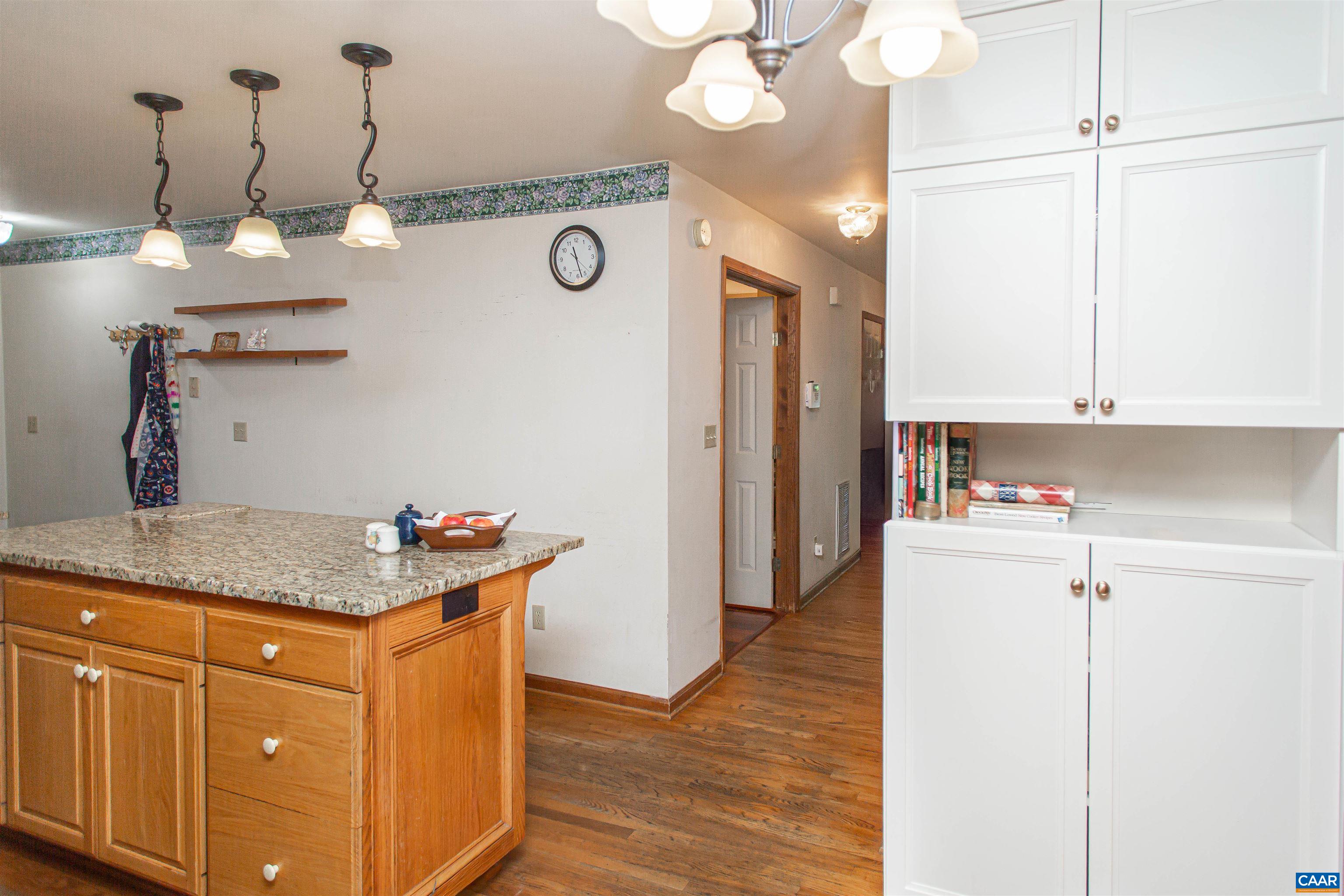 With granite counters & a large island. With granite counters & a large island.